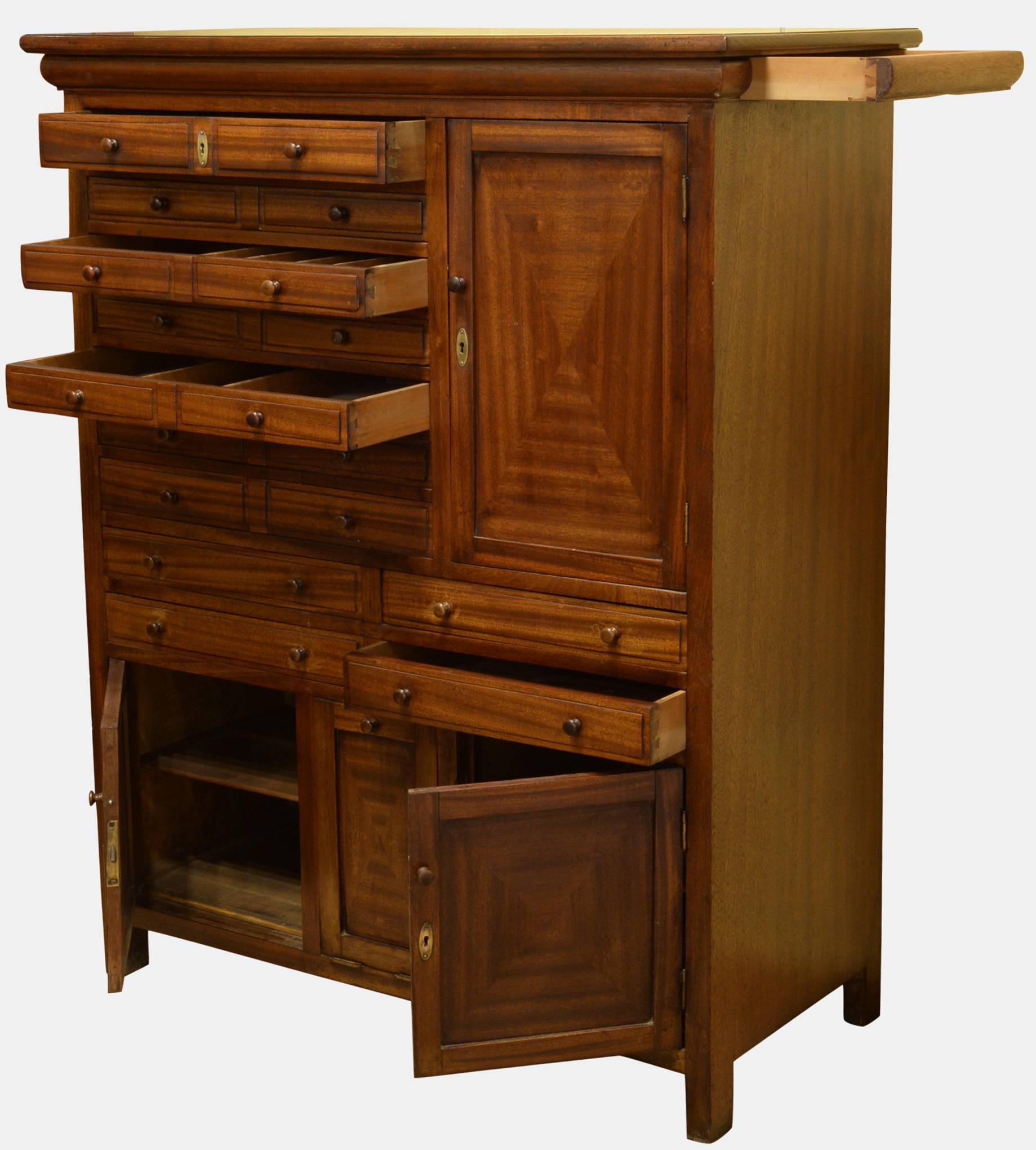 Mahogany dental cabinet with two secret drawers under top on each side,

circa 1920.