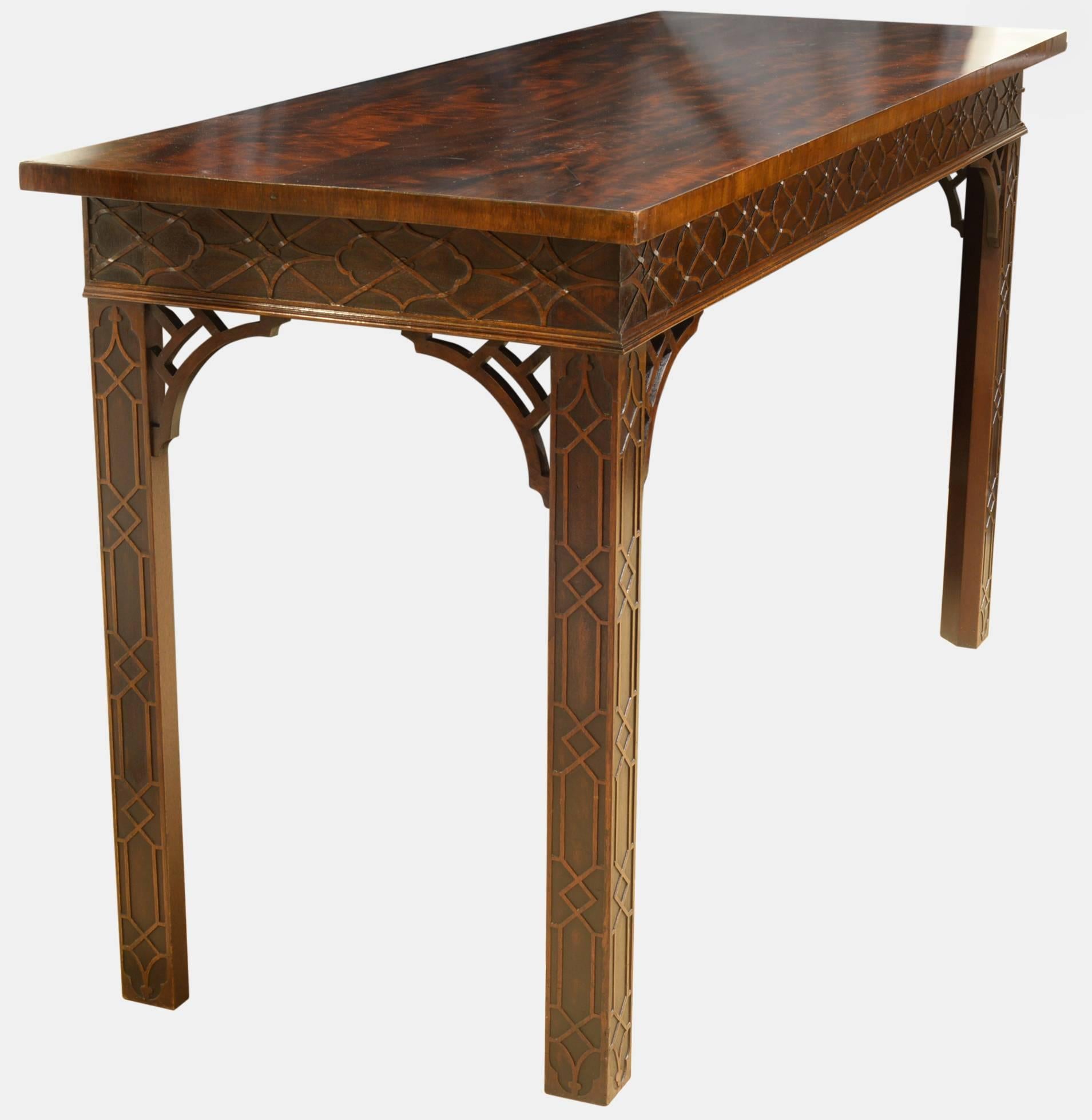 A mahogany Chippendale style 19th century serving table with blind fret decoration to the apron,

circa 1830.