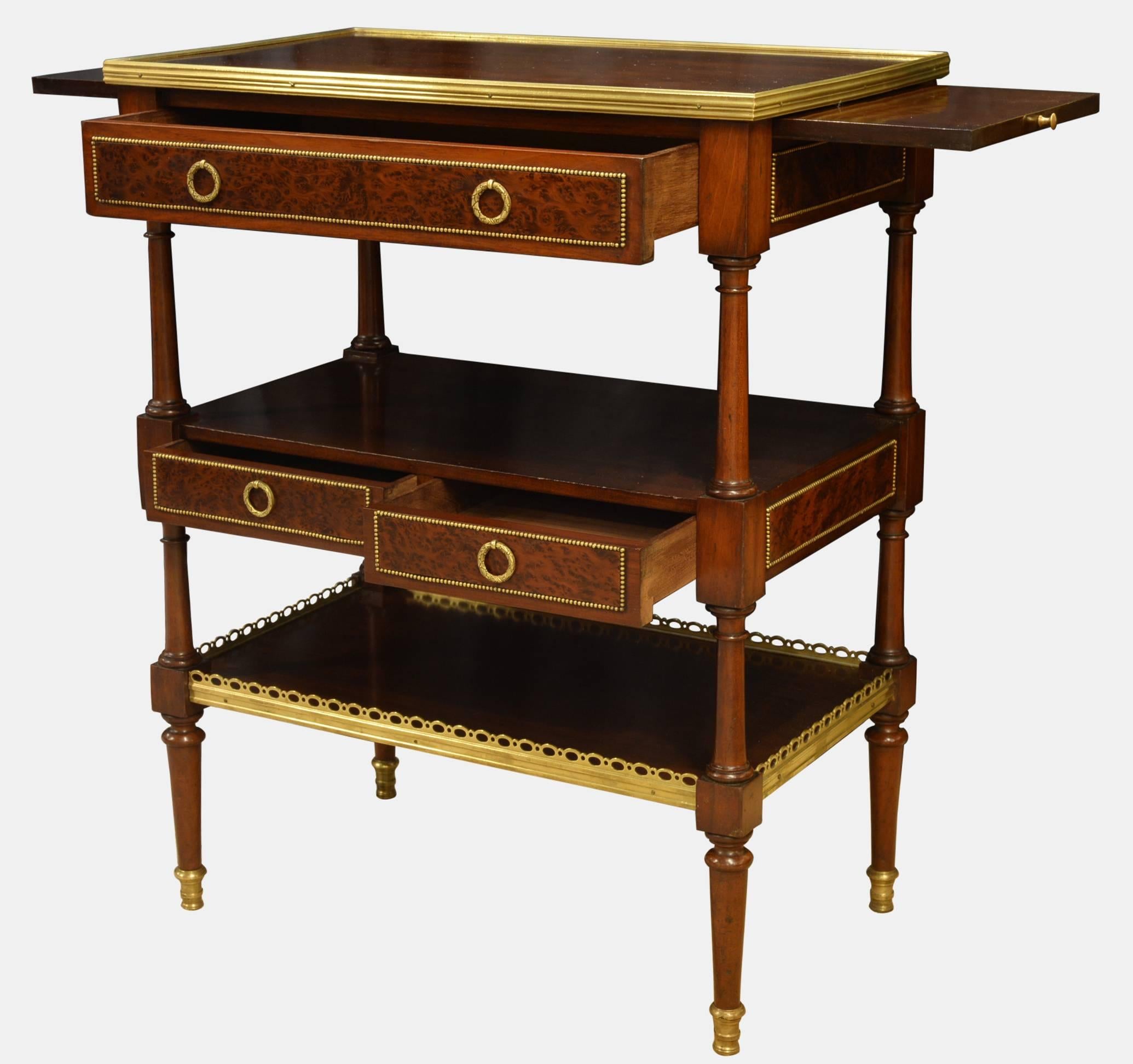 French Directoire style mahogany etagere of very fine quality. A rare feature being the brass beaded panels to four sides. An elegant and useful drawing room or bedside table,

circa 1890.