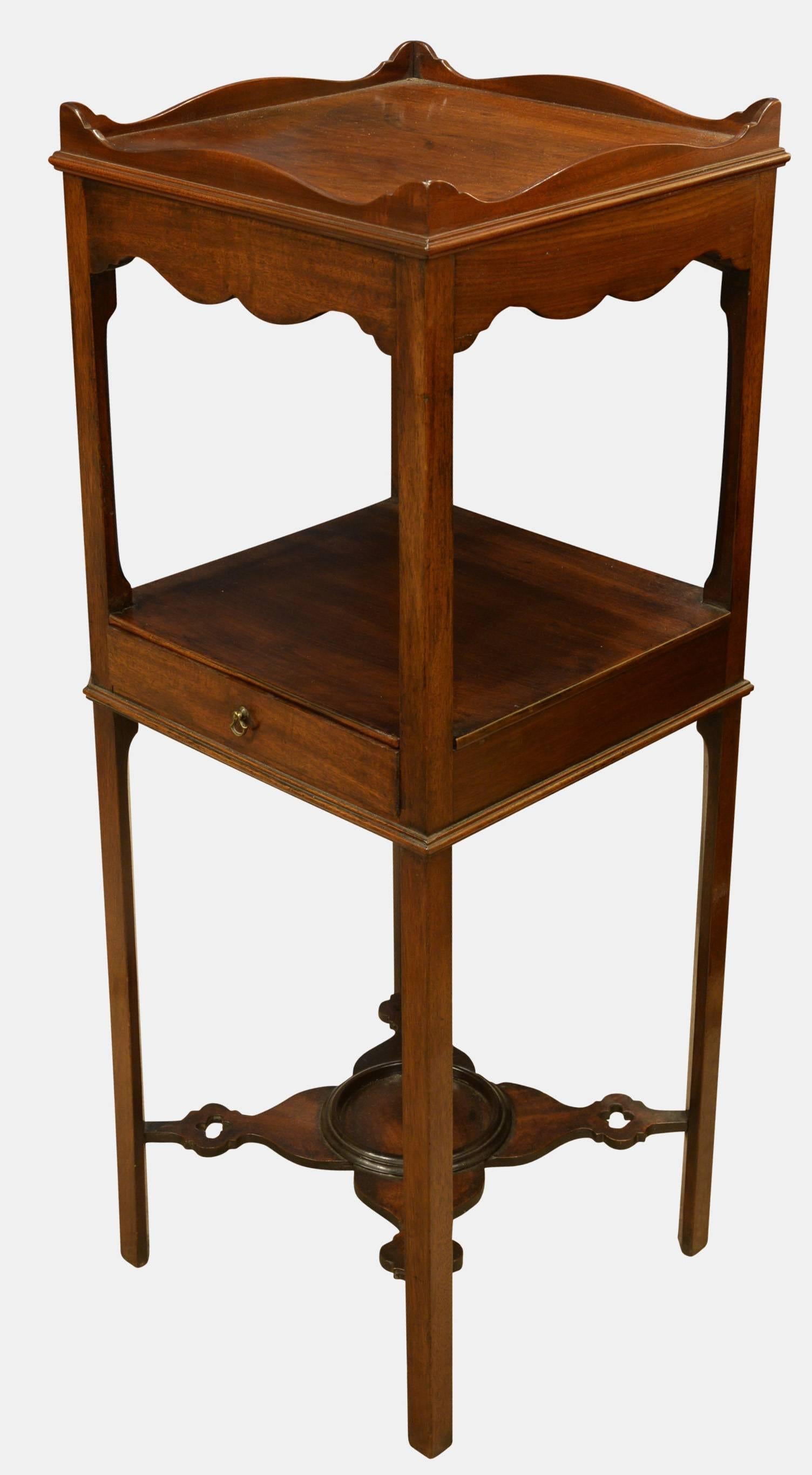 George III mahogany shaving stand with a fine pierced stretcher, centre drawer and galleried top,

circa 1760.