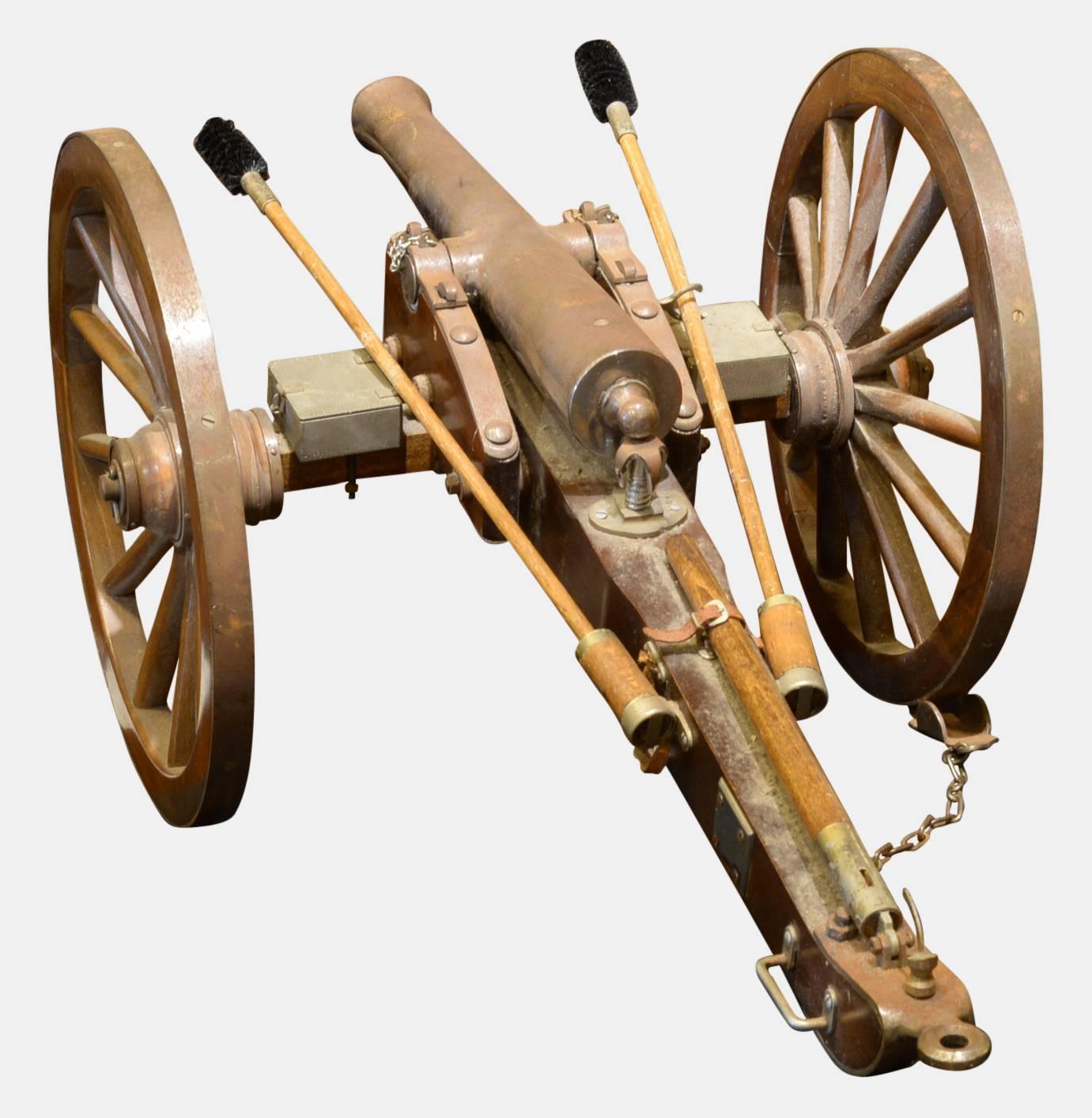 A good scale model of a mid-19th century field gun, the barrel mounted on a wood carriage.

The barrel stamped 'Made in Spain'.

circa 1940.