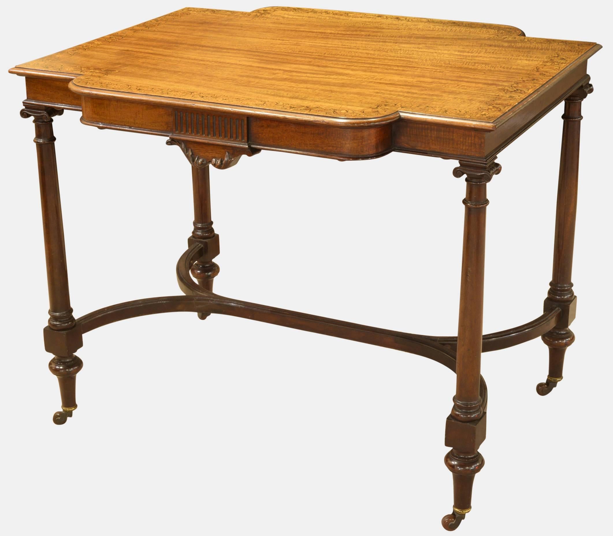 An early Victorian mahogany centre table with satin inlay decoration to the edge and 'Y' stretcher underneath.