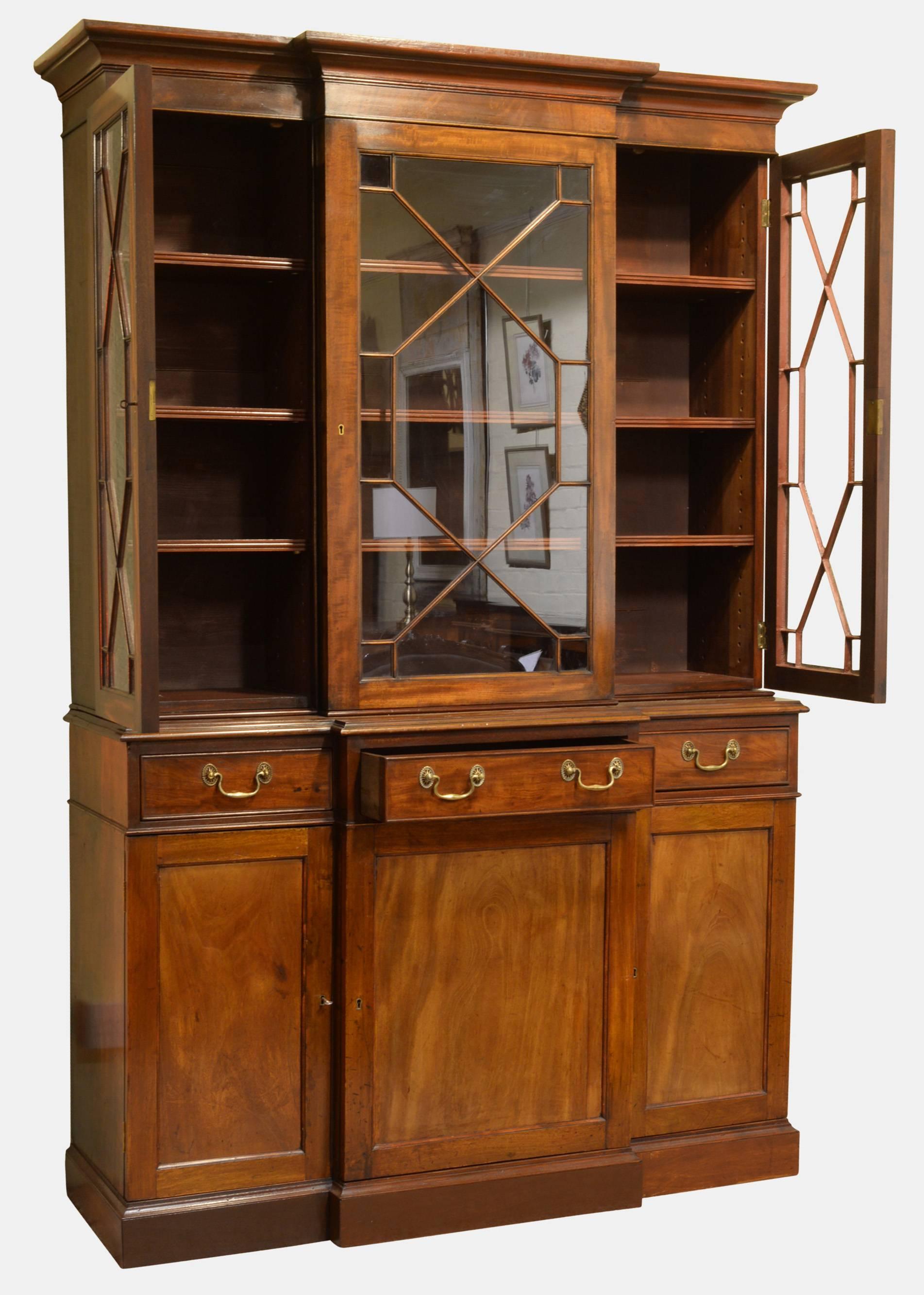 A George III style mahogany small breakfront bookcase,

circa 1960.