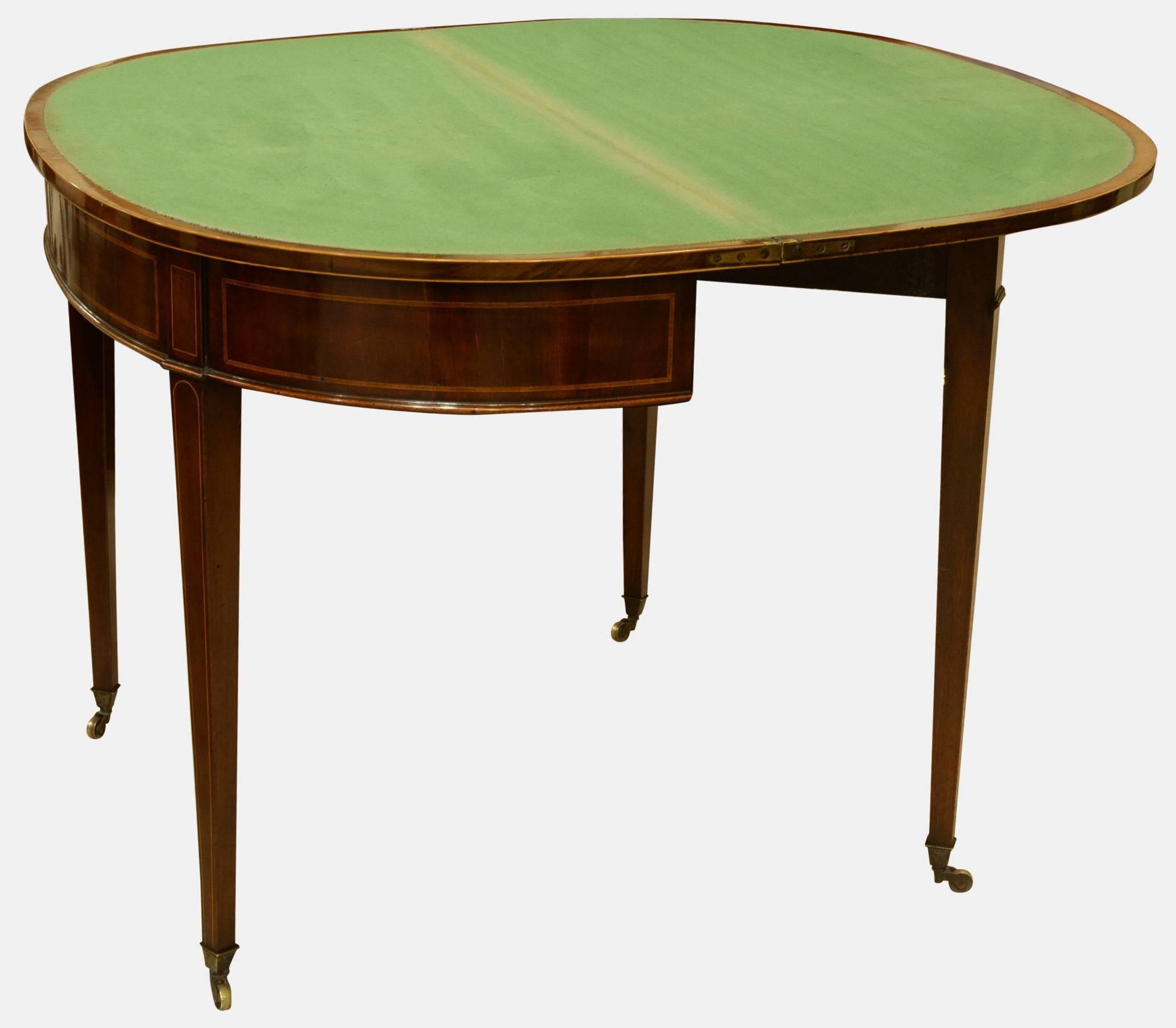 A Georgian mahogany and kingwood crossbanded demilune card table,

circa 1790.