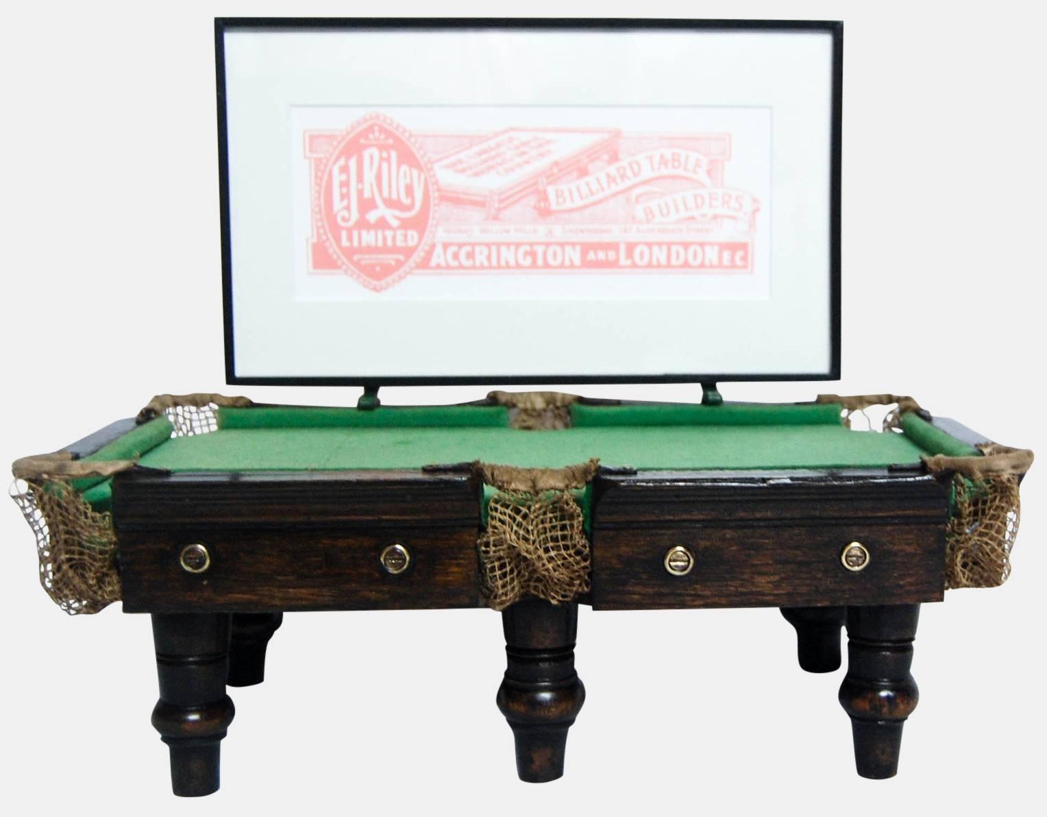 A rare miniature billiards table shop advertising display for E.J. Riley.

c 1920.