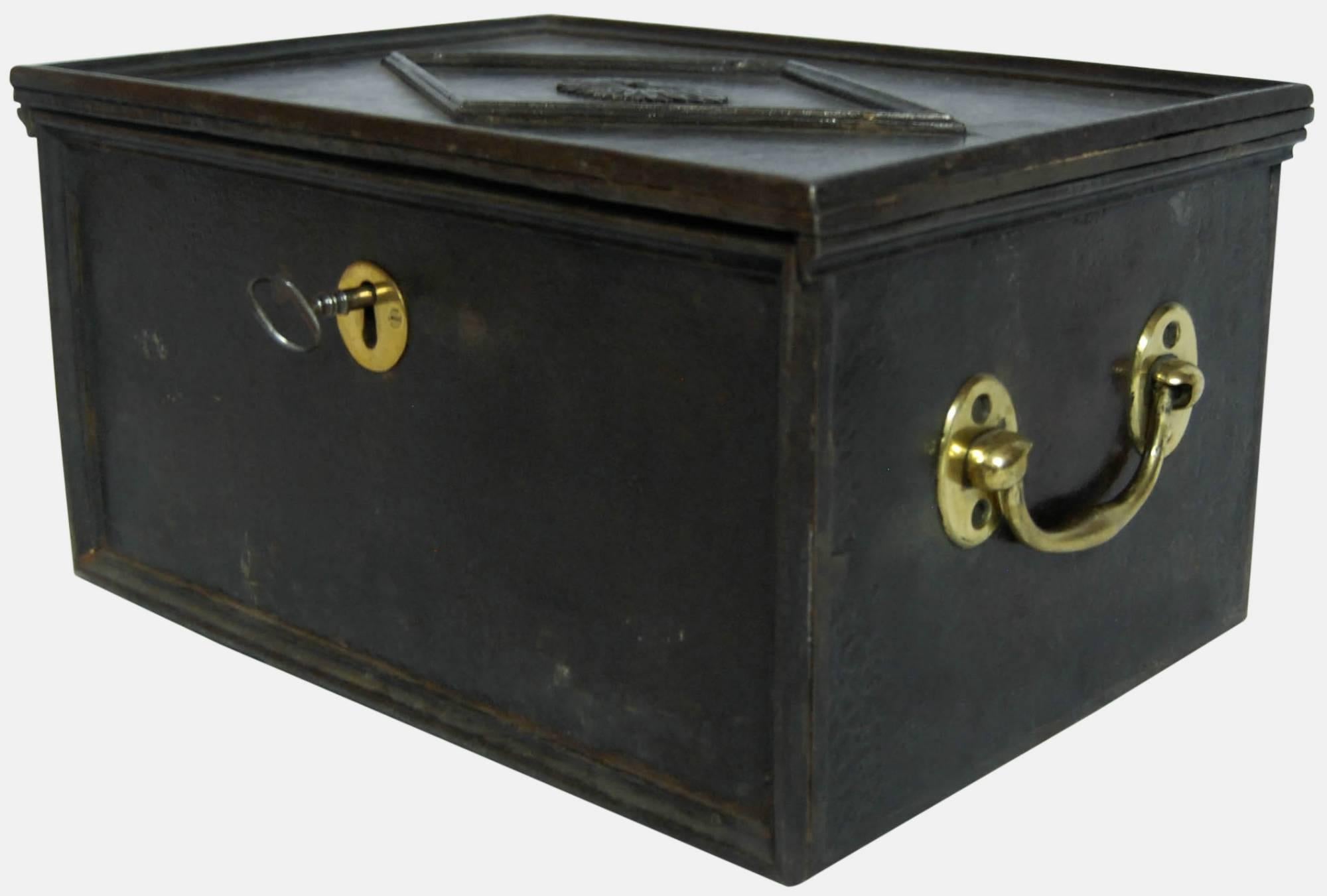 Early 19th century cast iron strong box with floral pattern motif.
