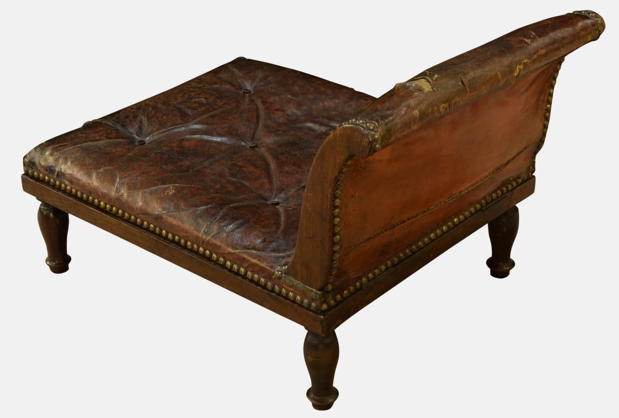Georgian mahogany gout stool with original leather upholstery.
