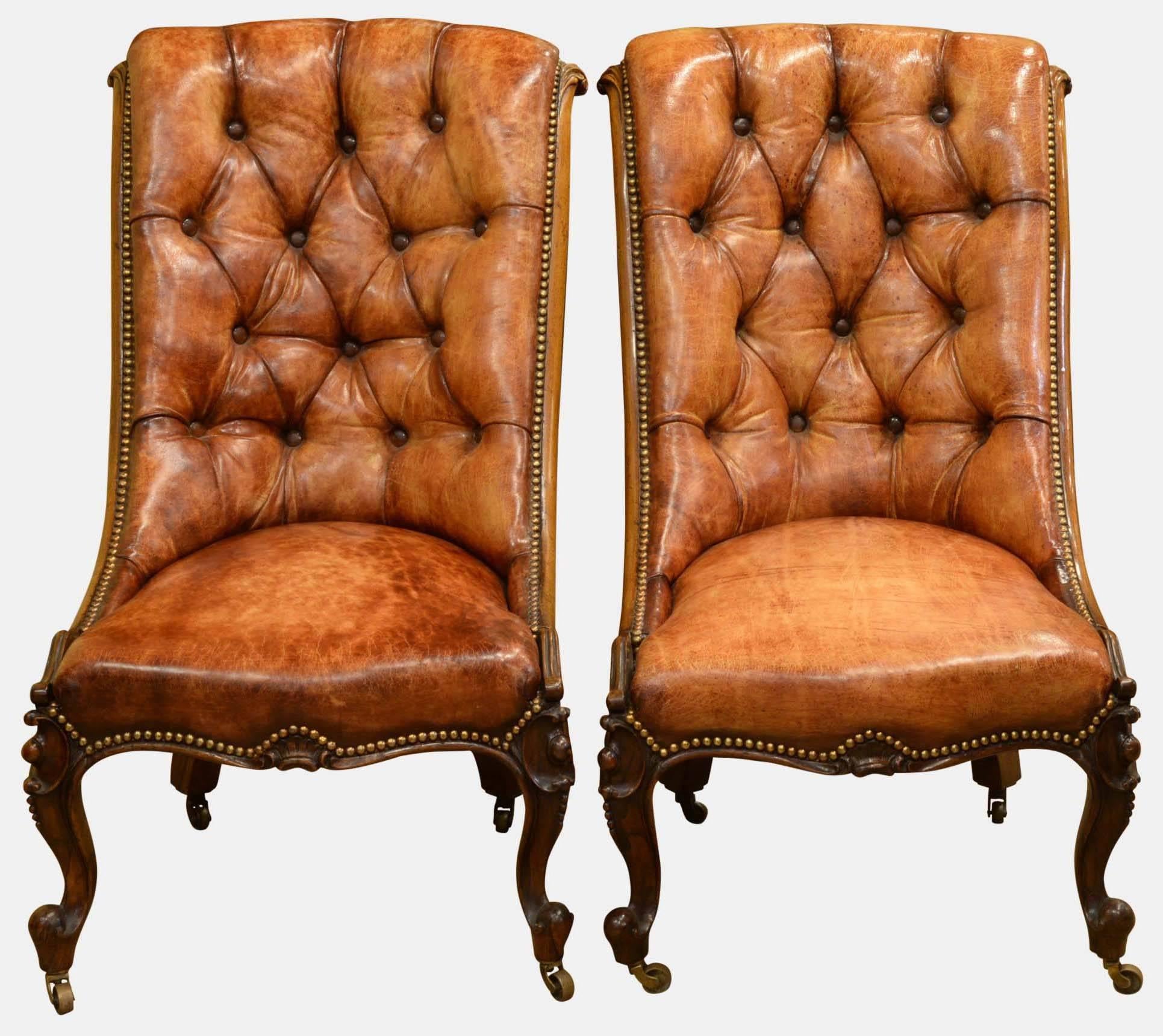 A pair of mid-19th century buttoned leather rosewood chairs by Flashman of Dover.

Dated 1856 on original scrim.