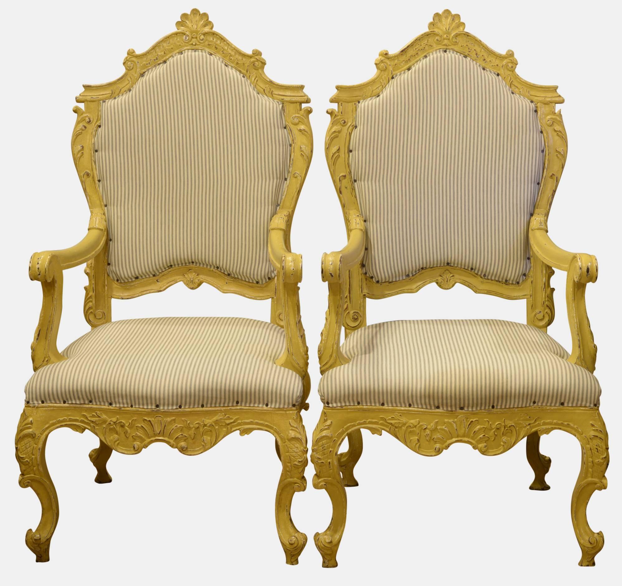 A pair of painted French armchairs, carved walnut upholstered in ticking, ready for new fabric.

19th century.