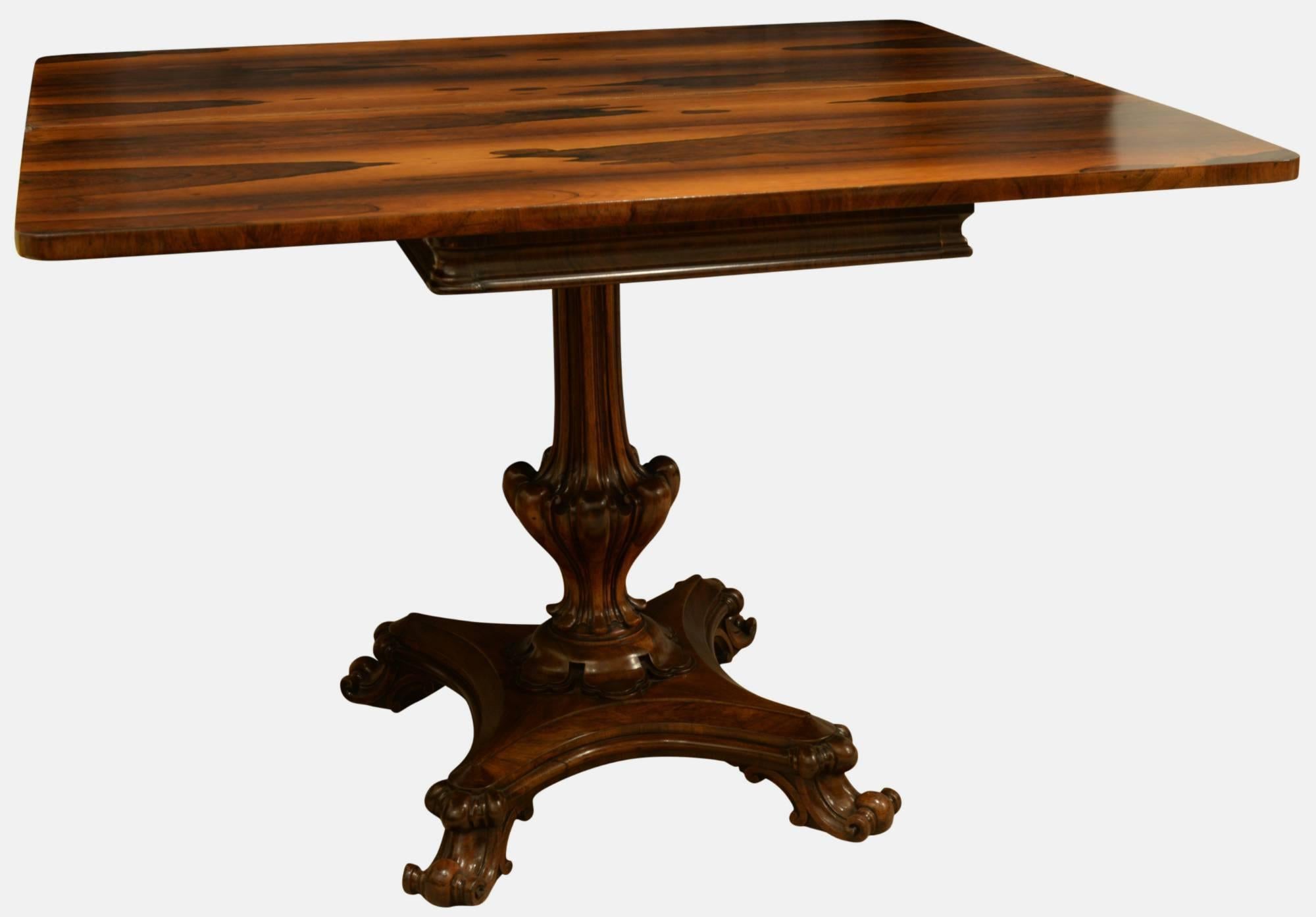 A beautifully figured Regency rosewood tea table,

circa 1830.