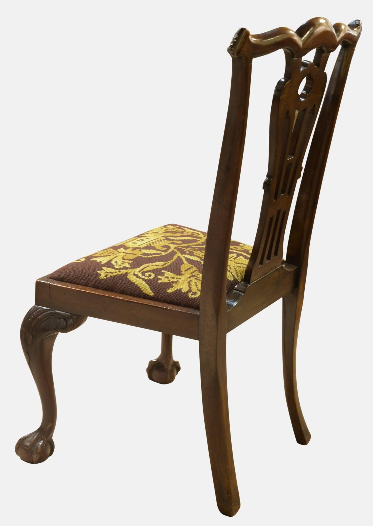 A set of eight Irish Chippendale style dining chairs on cabriole legs and claw and ball feet,

circa 1890.