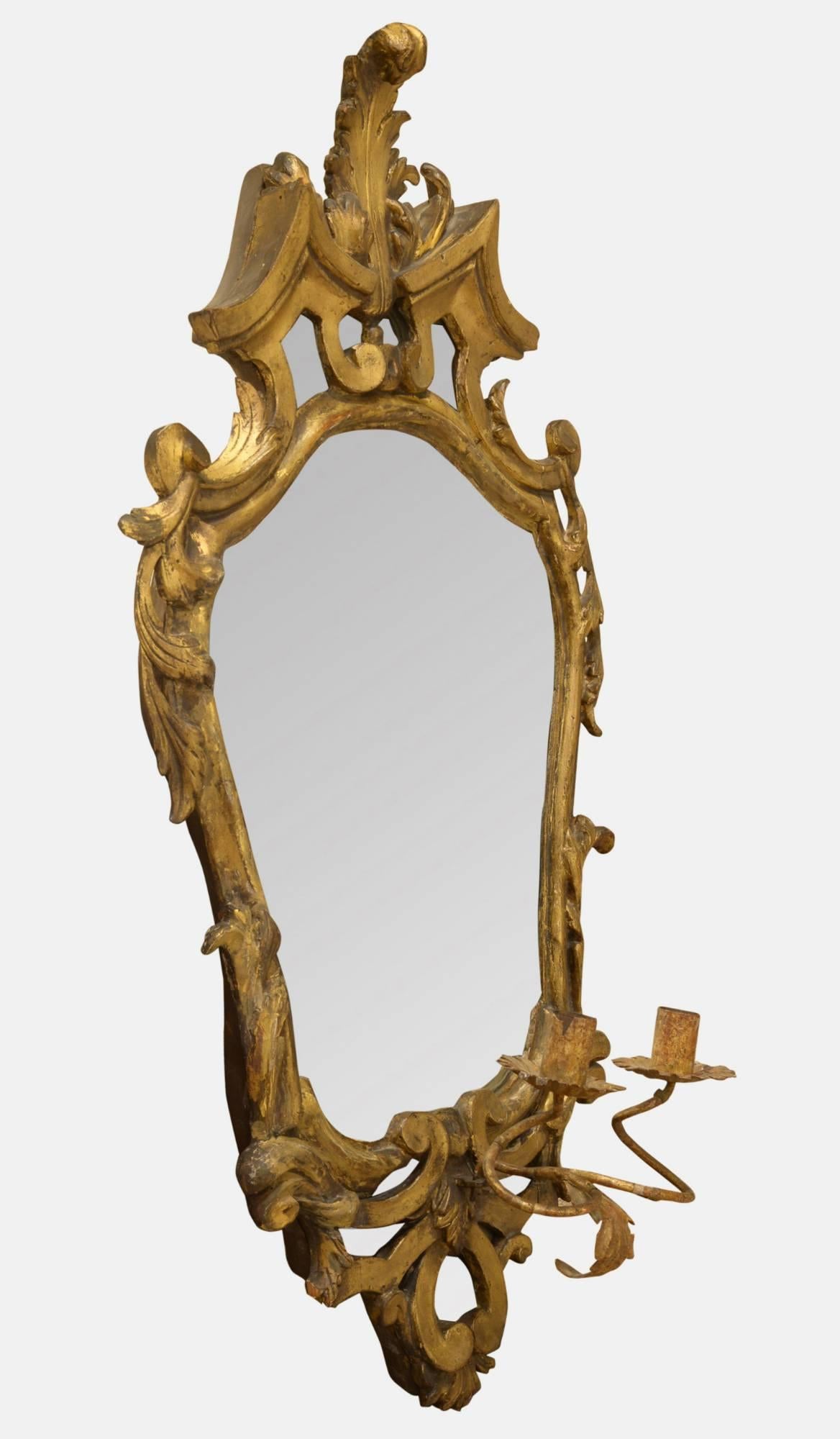 A gilded early 19th century Italian girandole mirror with etched decoration to the mirror panel and two sconces.
 