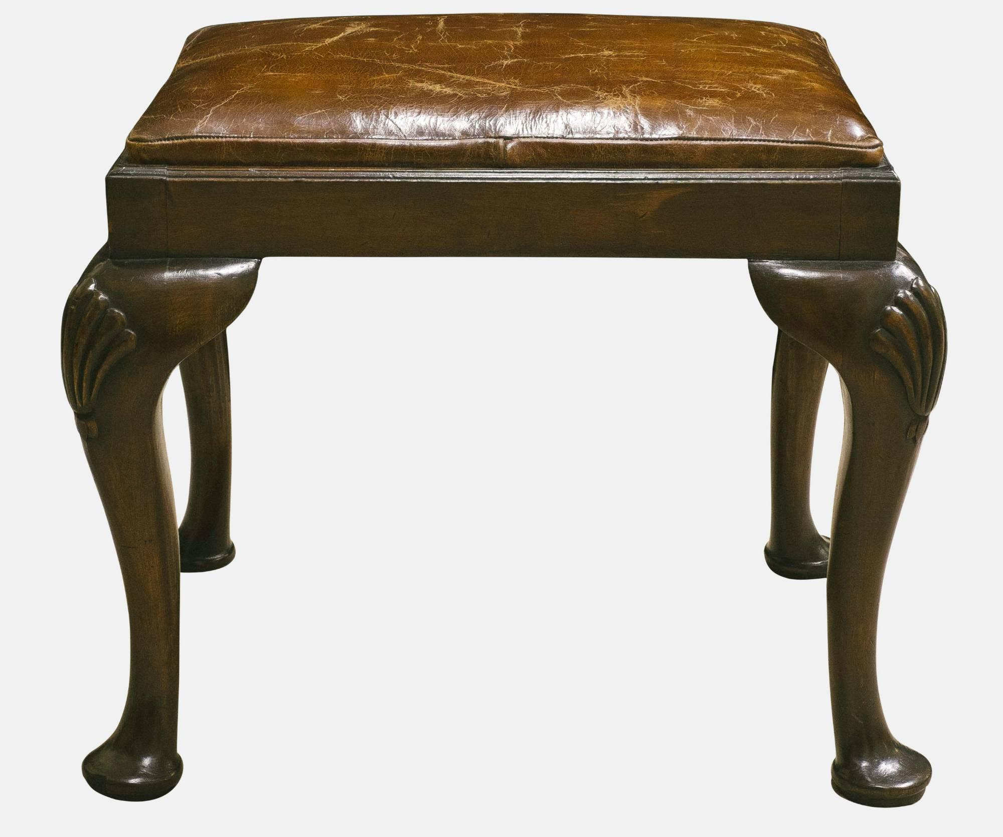 Mahogany and leather stool,
circa 1890.
        
