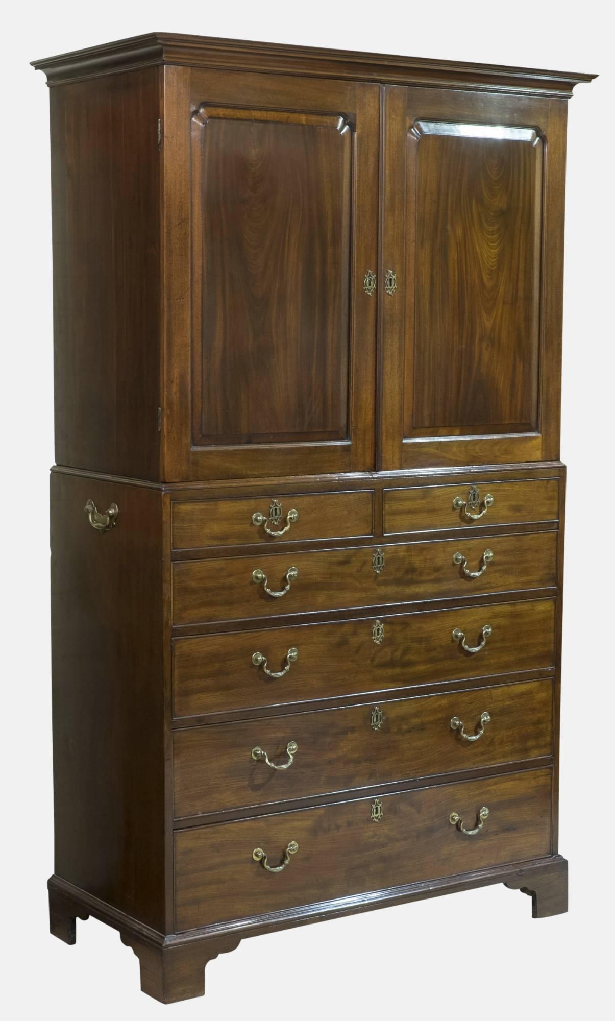 A George III Cuban mahogany cabinet on chest with brass gilded handles

circa 1770.