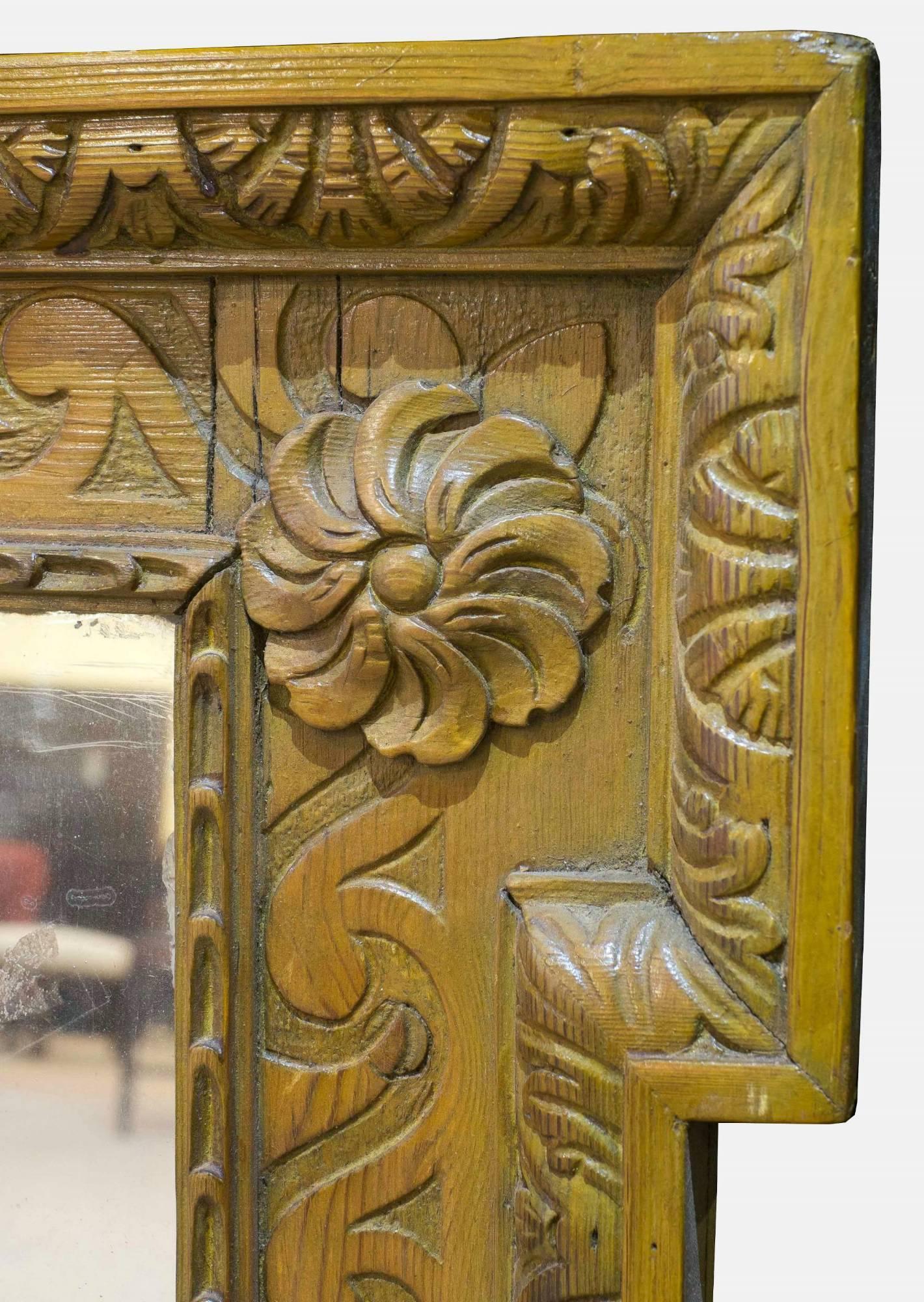 A carved pine landscape overmantel mirror in George I style with Vitruvian scroll decoration to border,

circa 1900.
     