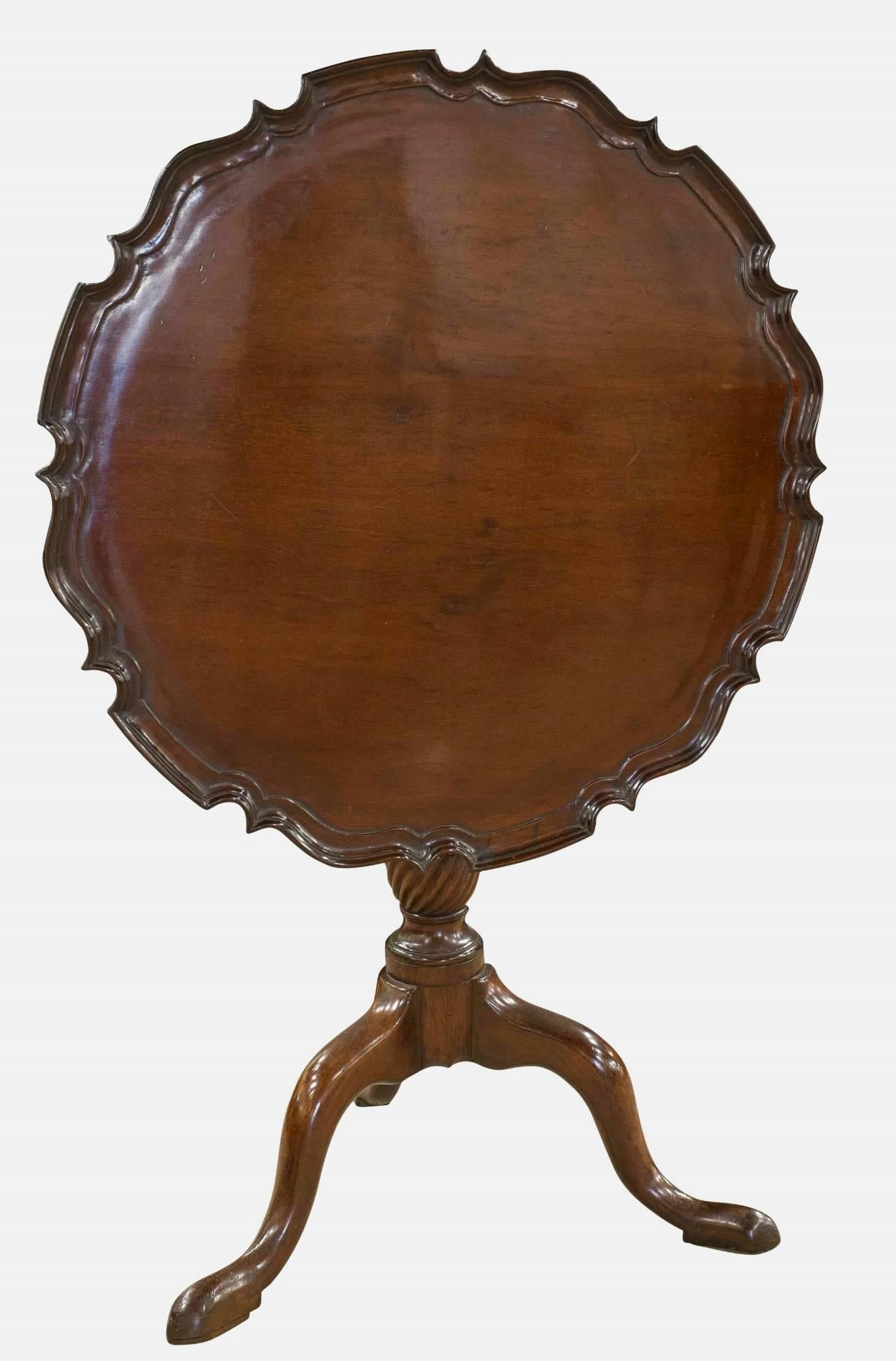 A mahogany pie crust tilt-top tripod table on cabriole legs

circa 19th century.
 