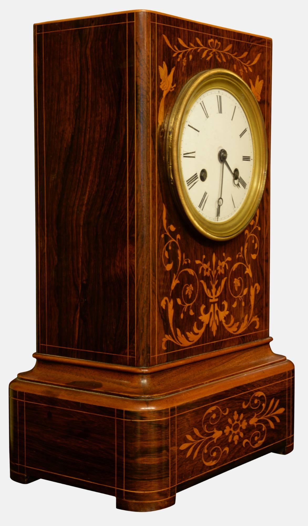 An excellent French inlaid rosewood cased mantel clock with white enamel dial and silk suspension. By Lageusse & Co. Paris, 

circa 1840.