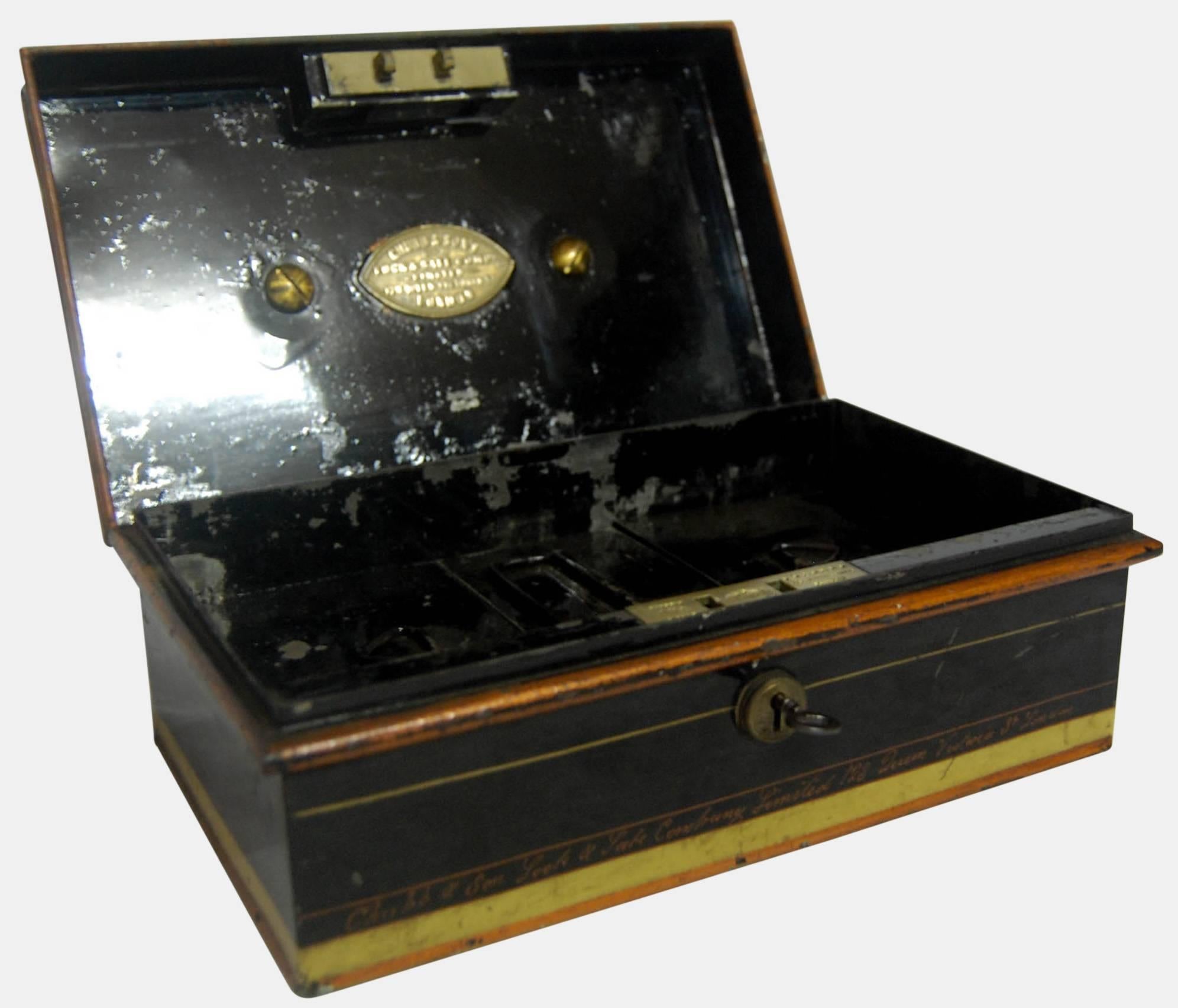 Edwardian Japanned metal and brass cash box by Chubb & Sons.