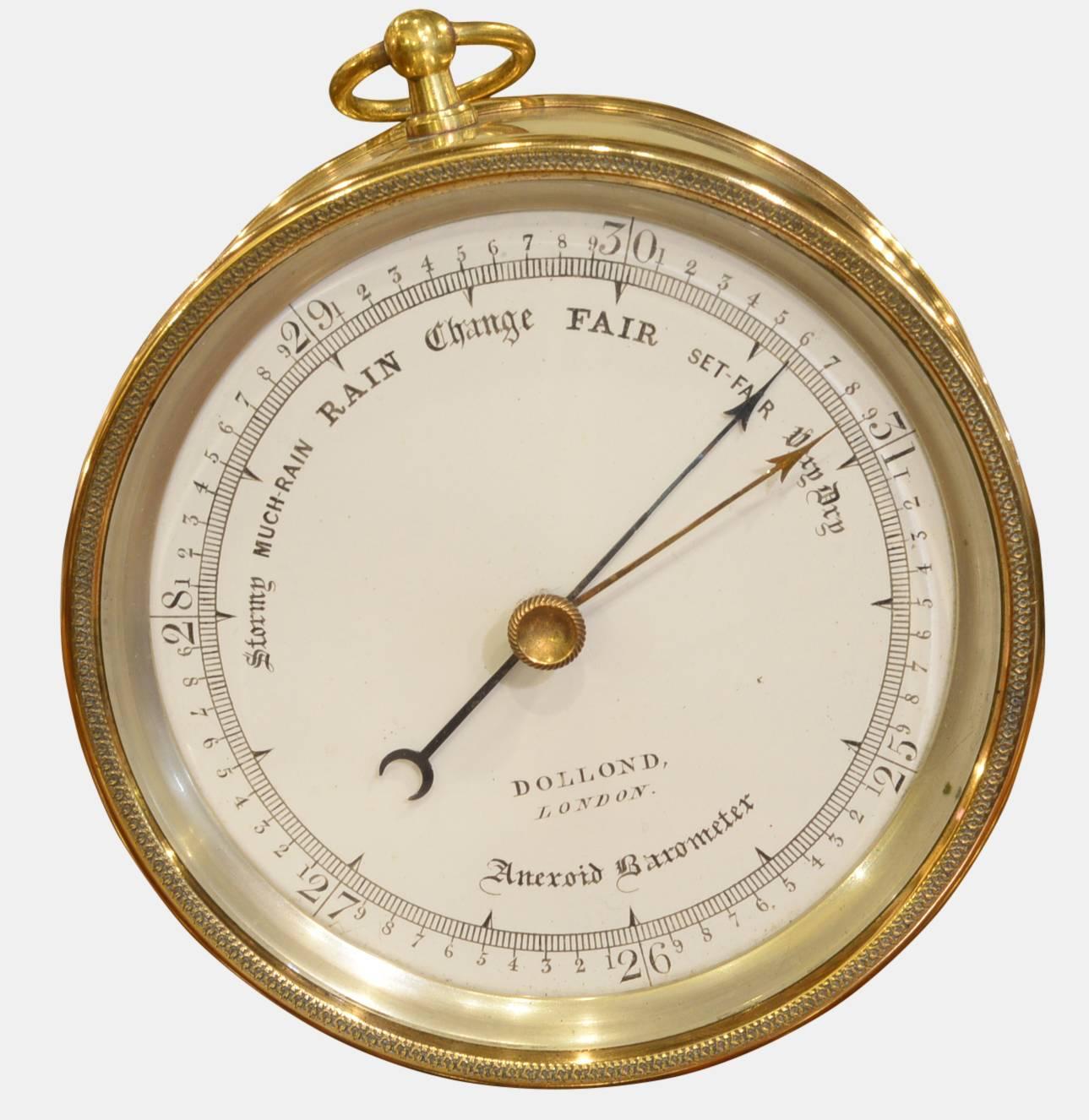 An early Victorian Vidie style brass cased aneroid barometer by Dubors and Casse.
