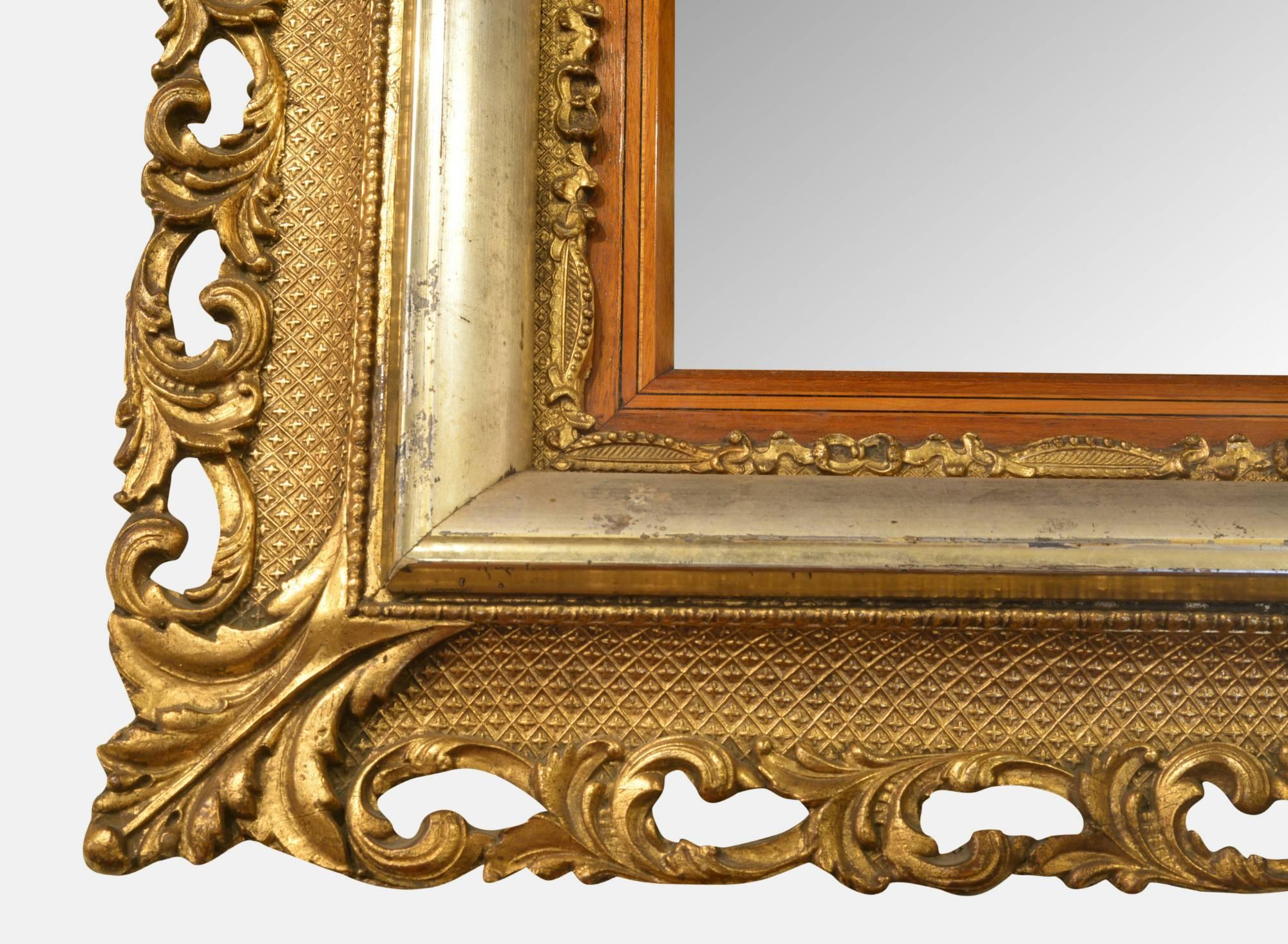 Ornate Victorian gilt framed mirror with bevel edged glass and just the right amount of foxing!