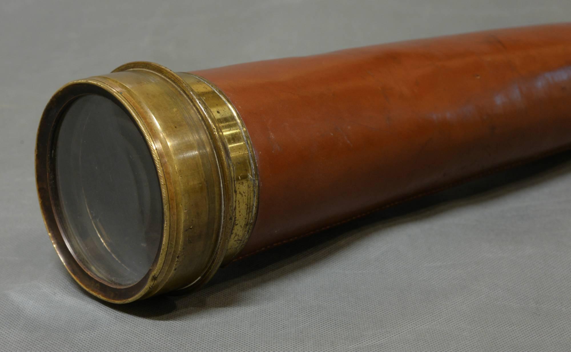 A large leather bound brass four-draw telescope by 