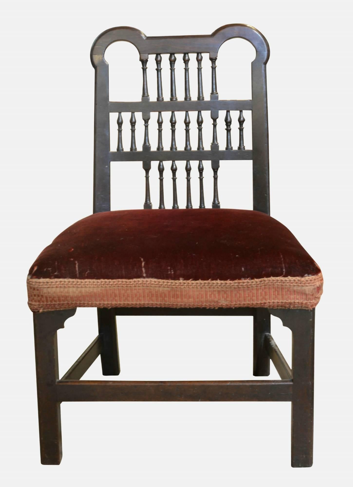A charming Chippendale period spindle back chair. Cuban mahogany, low back, nursing chair in original, untouched condition.
  