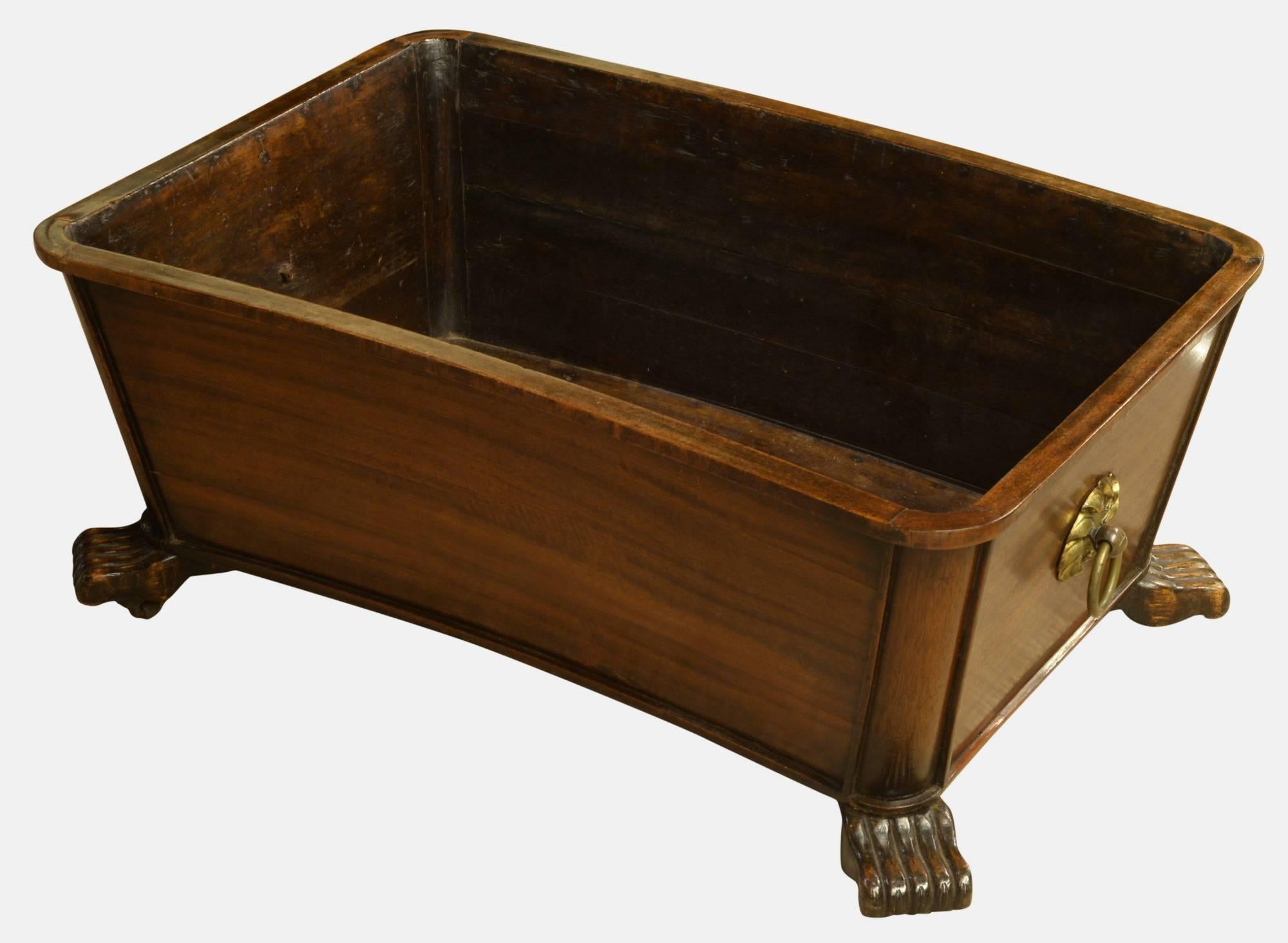 A George IV mahogany wine cooler with unusual paw feet.