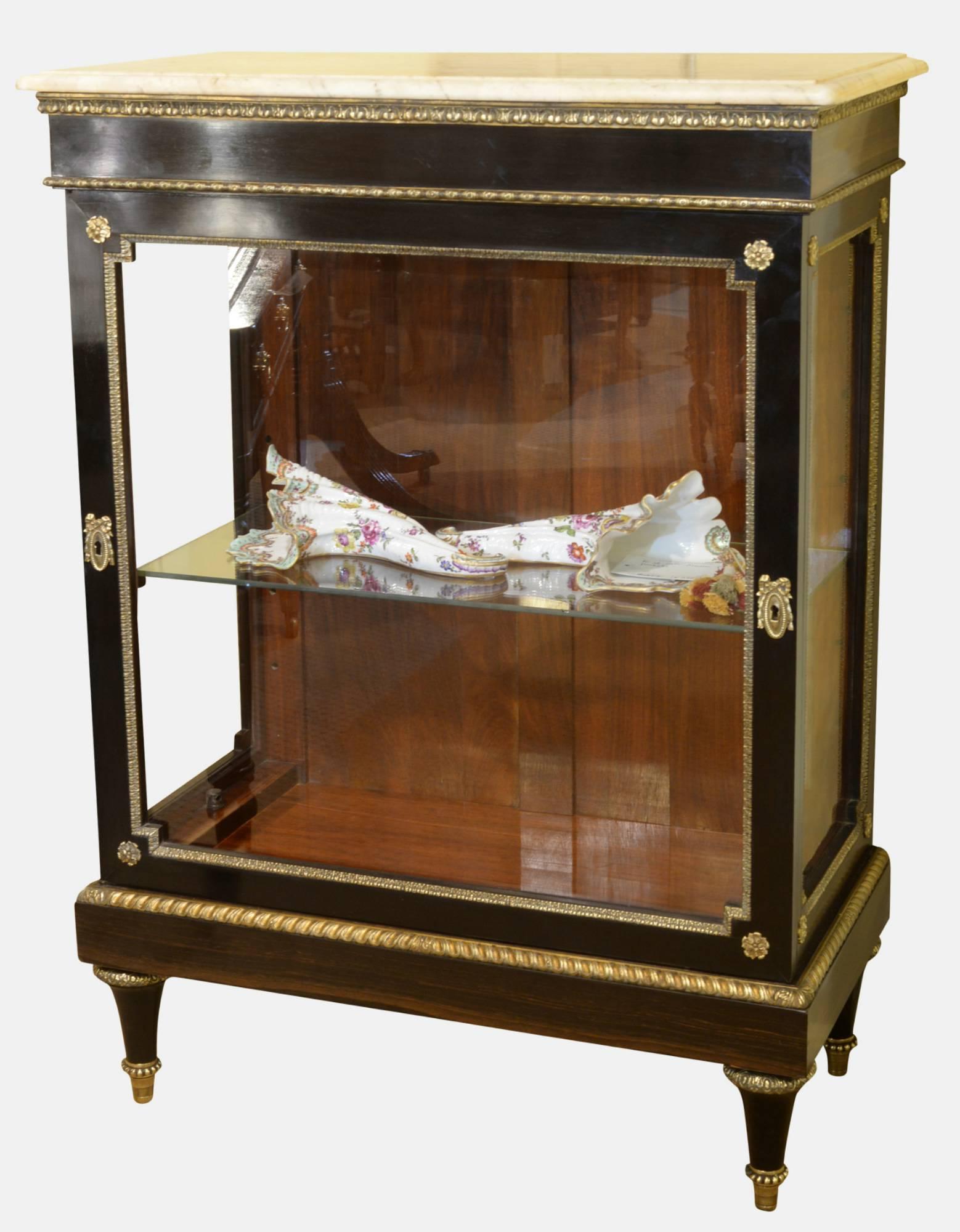 19th century French display cabinet in coromandel and polished mahogany interior and brass mounts. Original marble top, 

circa 1860.