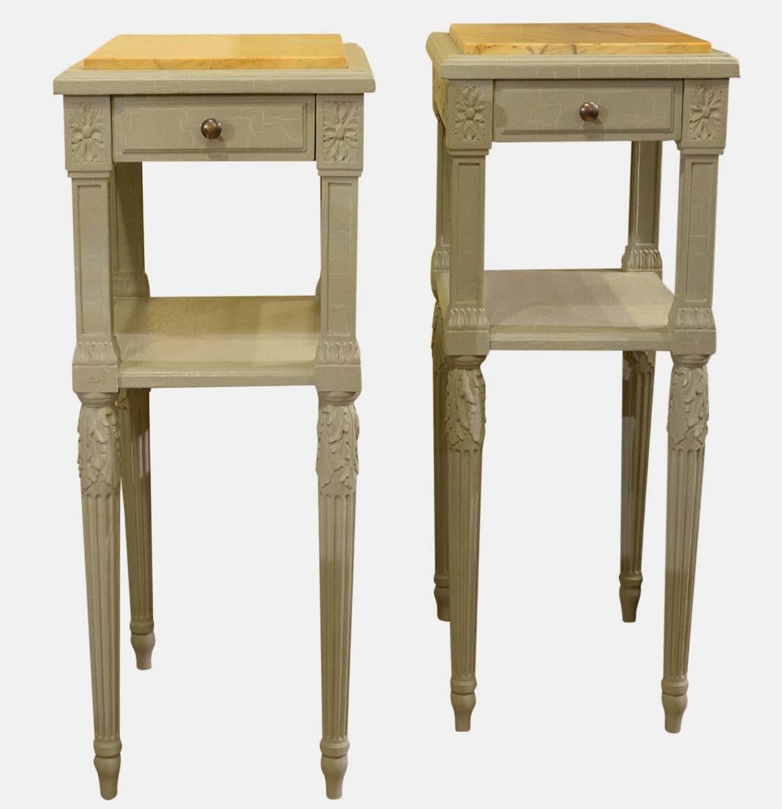 A pair of French Louis VXI style painted nightstands with sienna marble tops. Single drawer and shelf below,

circa 1900.