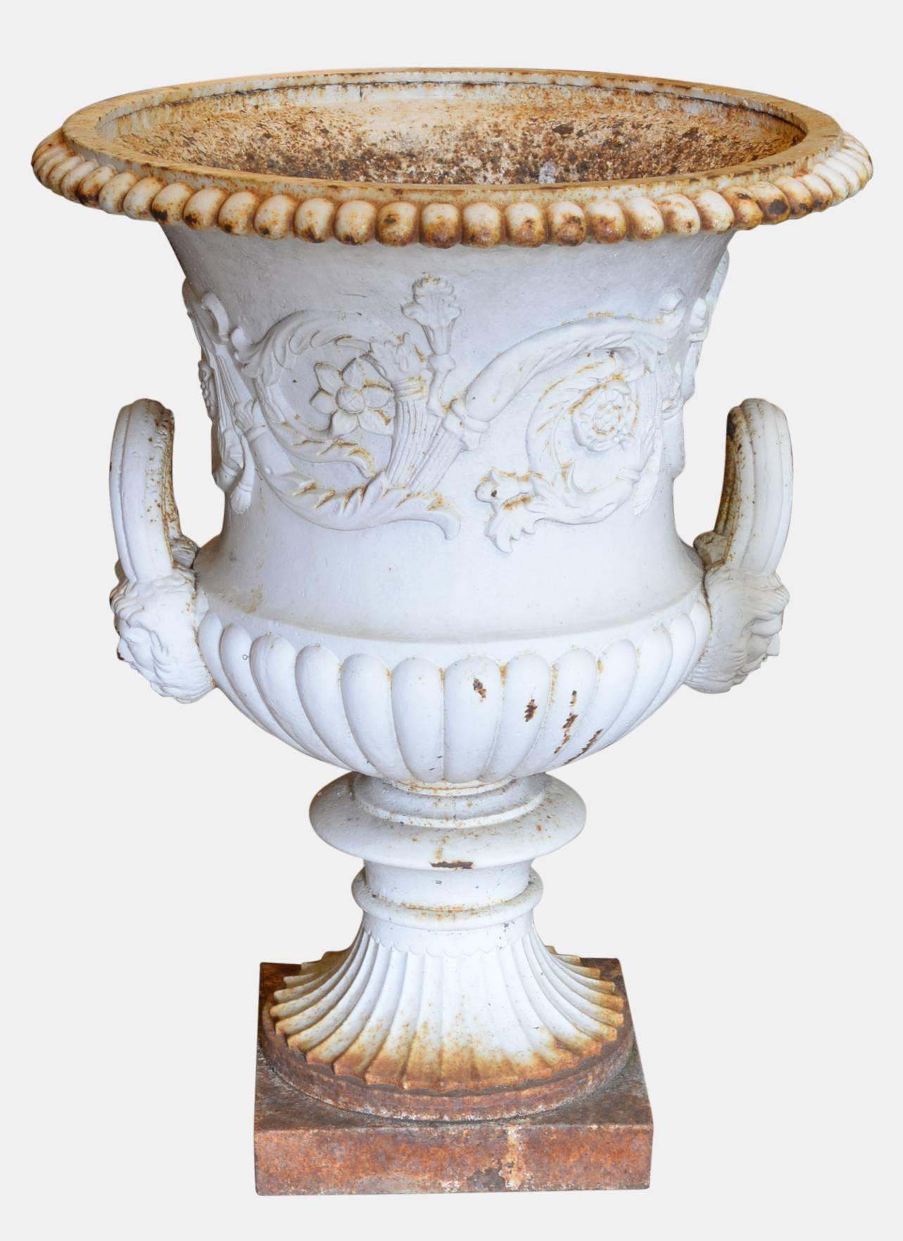 A pair of Coalbrookdale style cast iron campana shaped garden urns,

circa 1880.