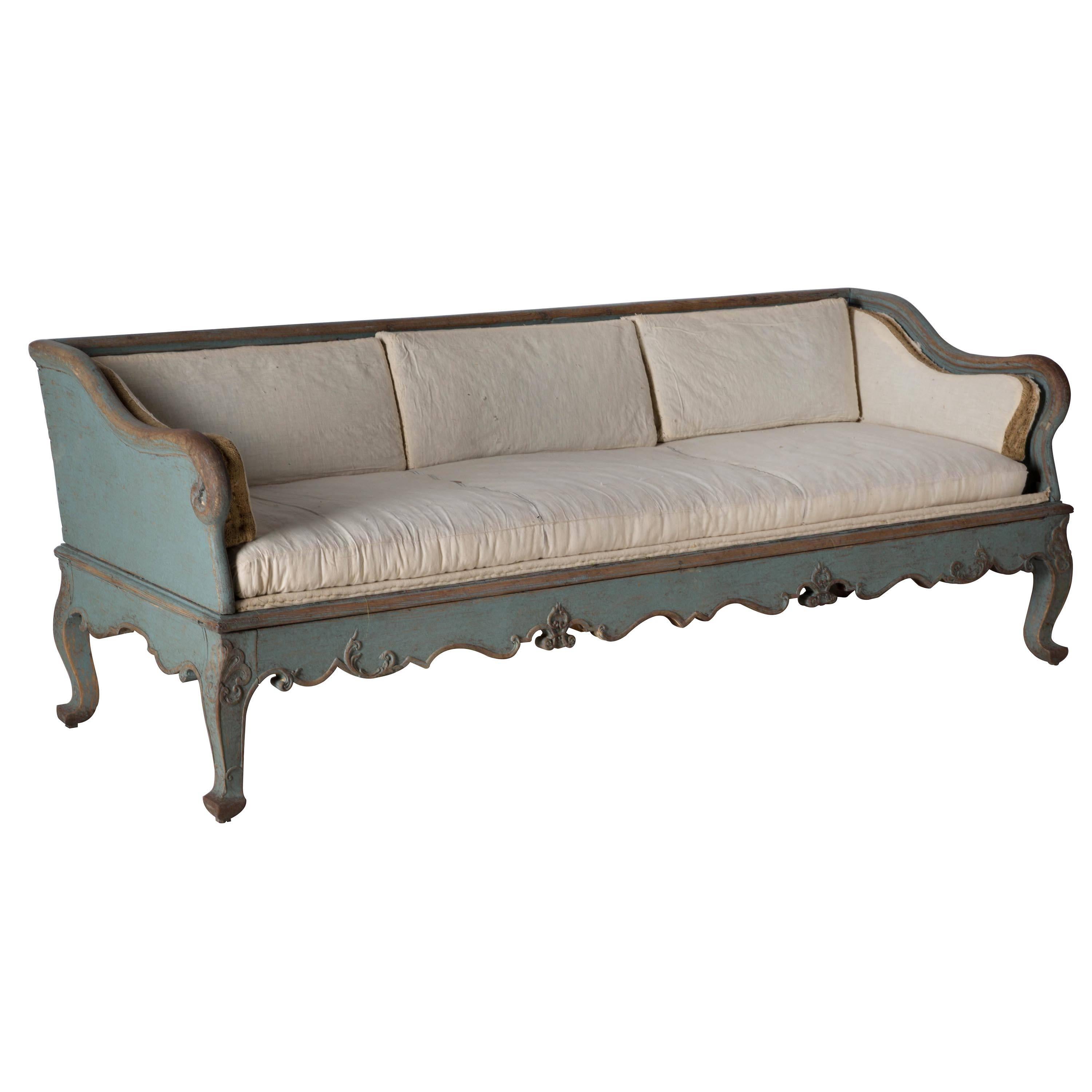 A period Rococo tragsoffa, circa 1760 – repainted. Seat height 46cm.