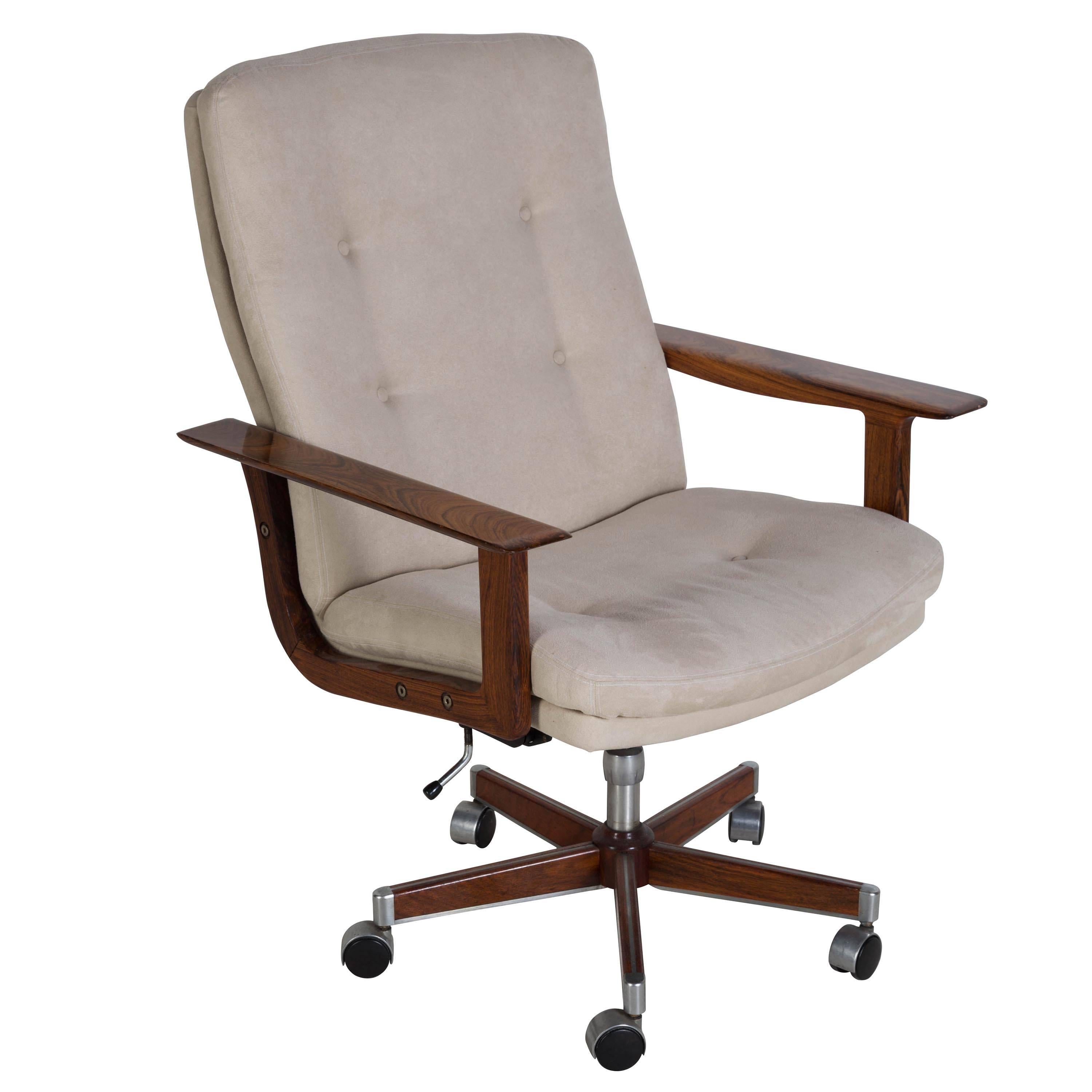 A scarce desk chair by Hans Wegner. Now re-covered in a similar color Alcantara. Seat height 48cm. Seat depth 47cm.