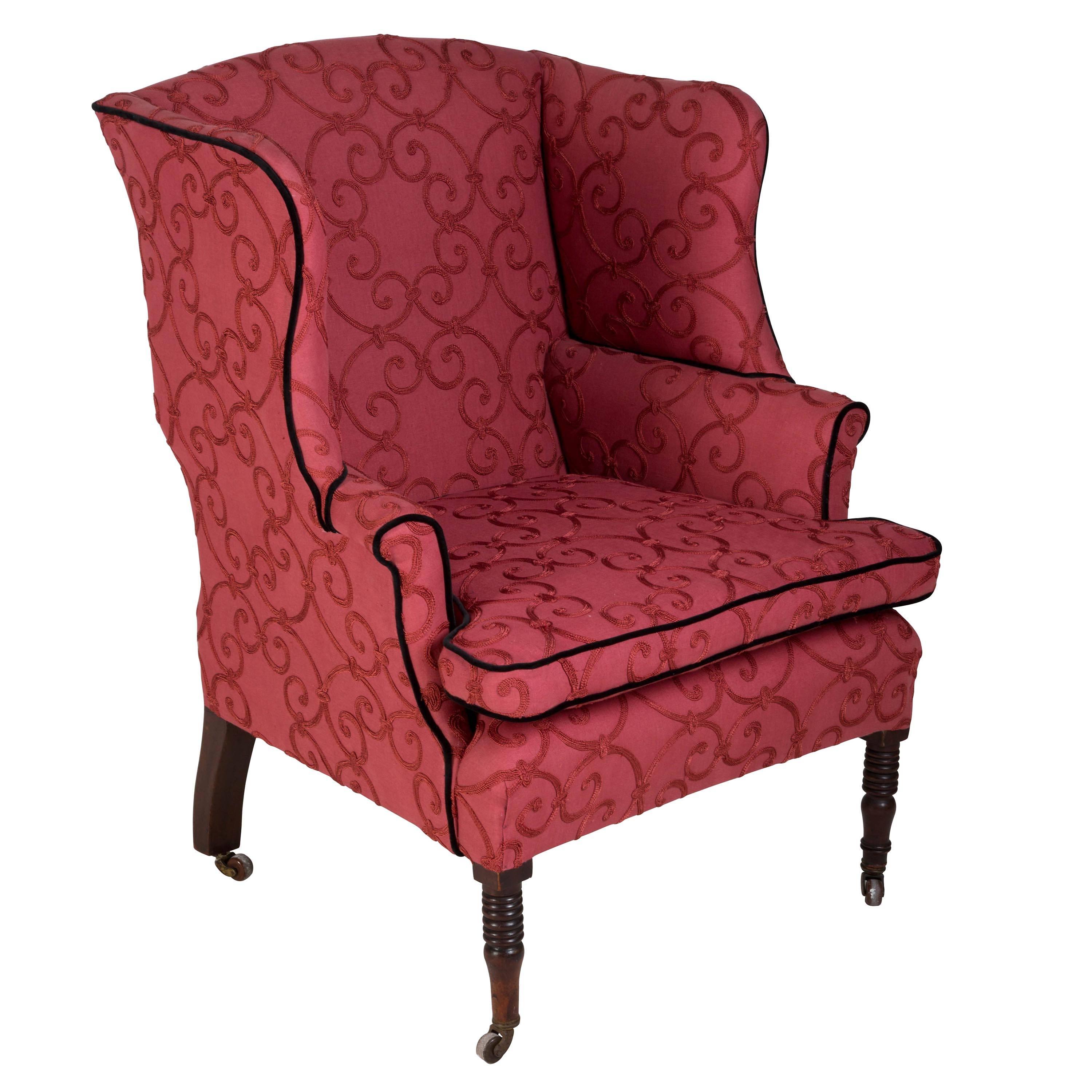 A grand scale English Regency period wing armchair, circa 1820. Seat depth 58cm.