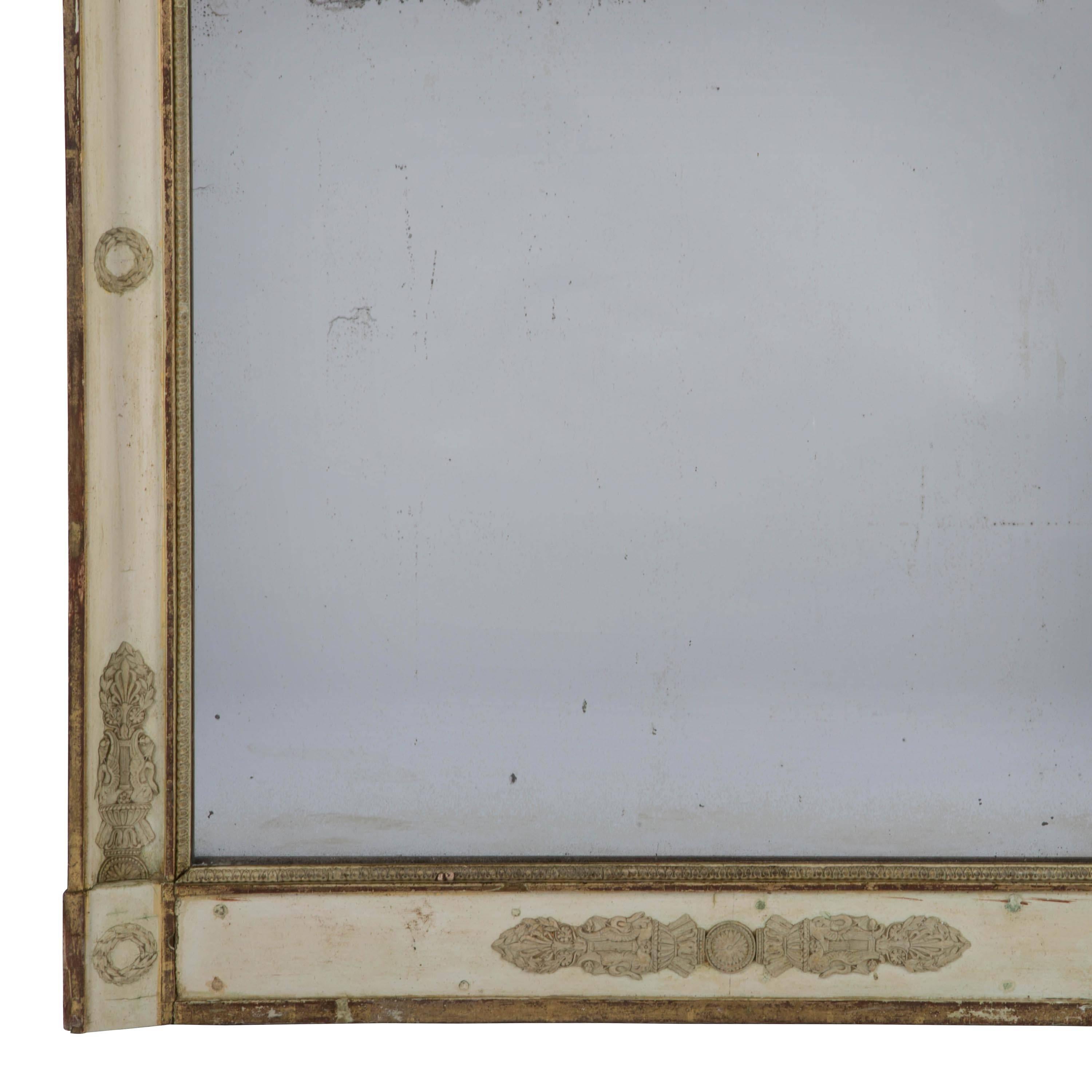 A 19th century French Empire gilt and gesso frame mirror with original mercury glass plate.