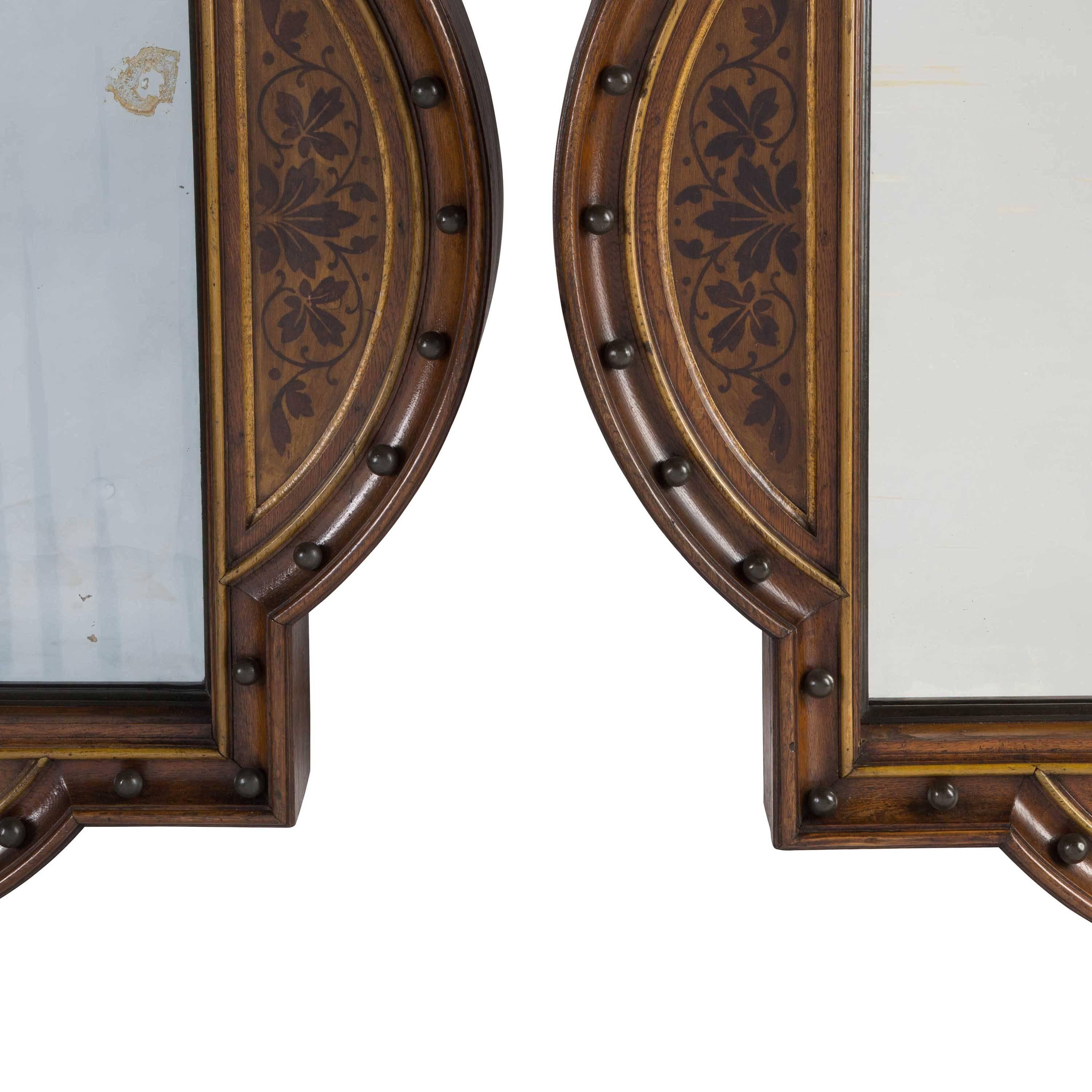 Pair of oak Arts & Crafts mirrors.