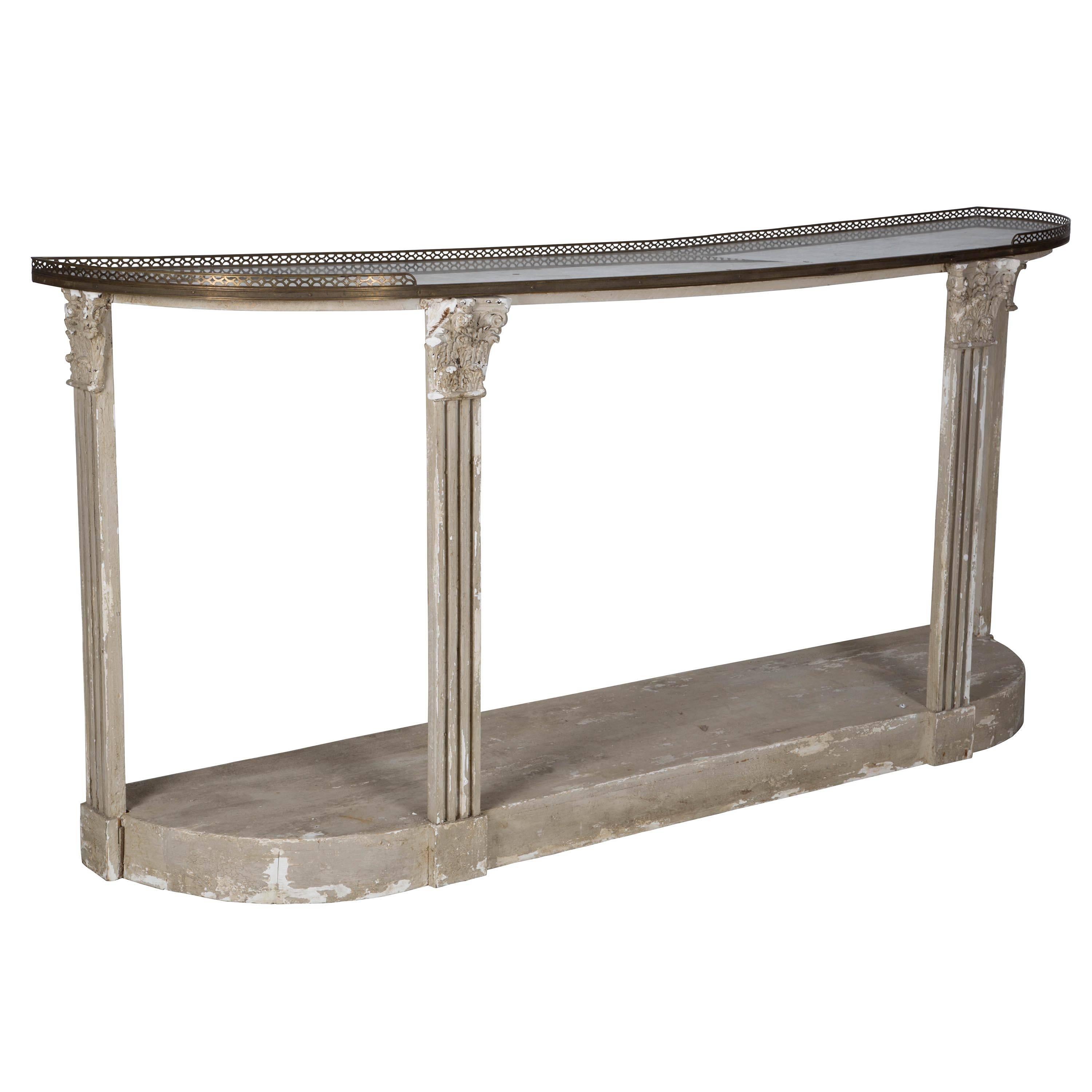 An Irish marble topped side table with brass gallery, retaining a lovely old white painted surface, circa 1920.