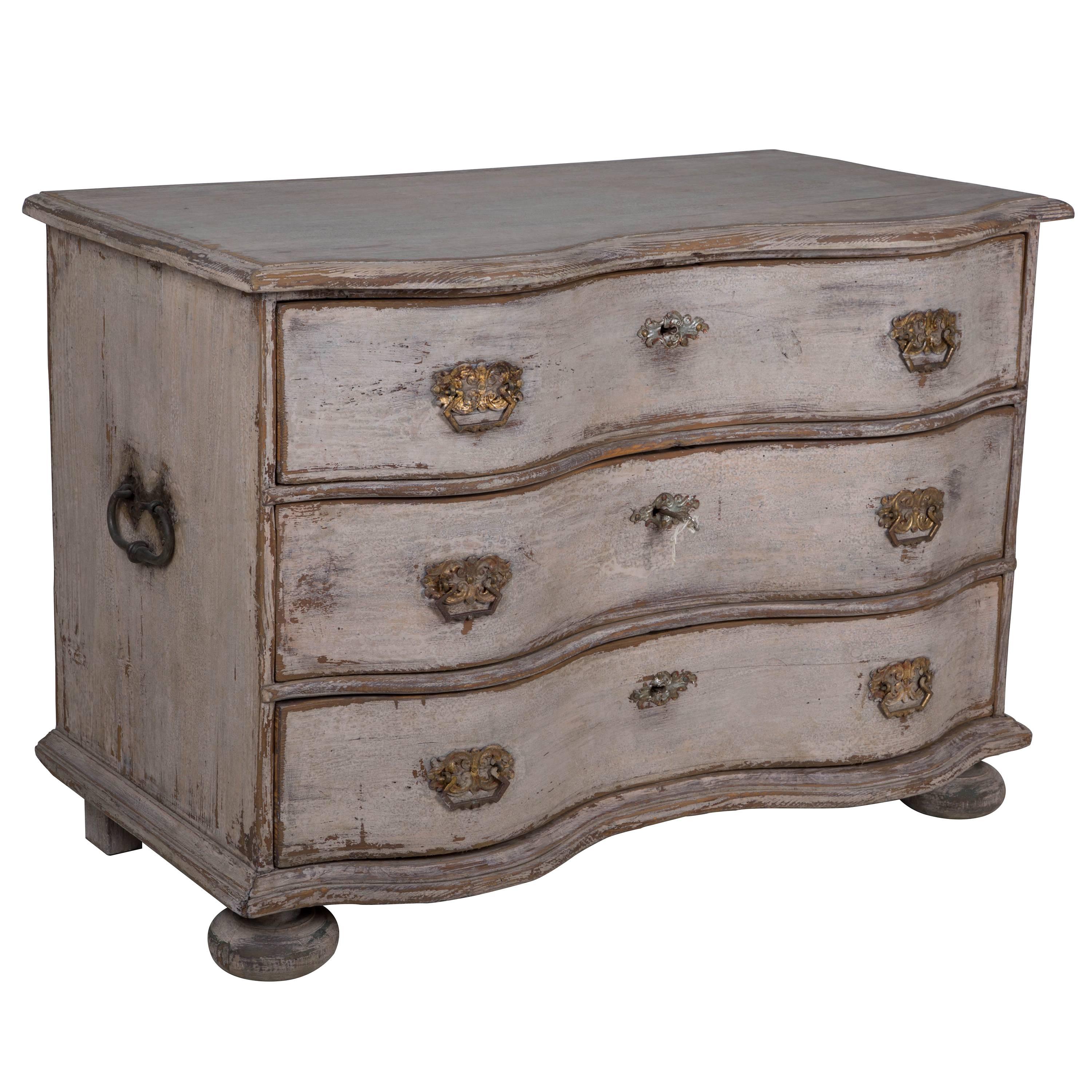 A Swedish Baroque period serpentine front commode with original carrying handles, restored paintwork.  Swedish c.1725