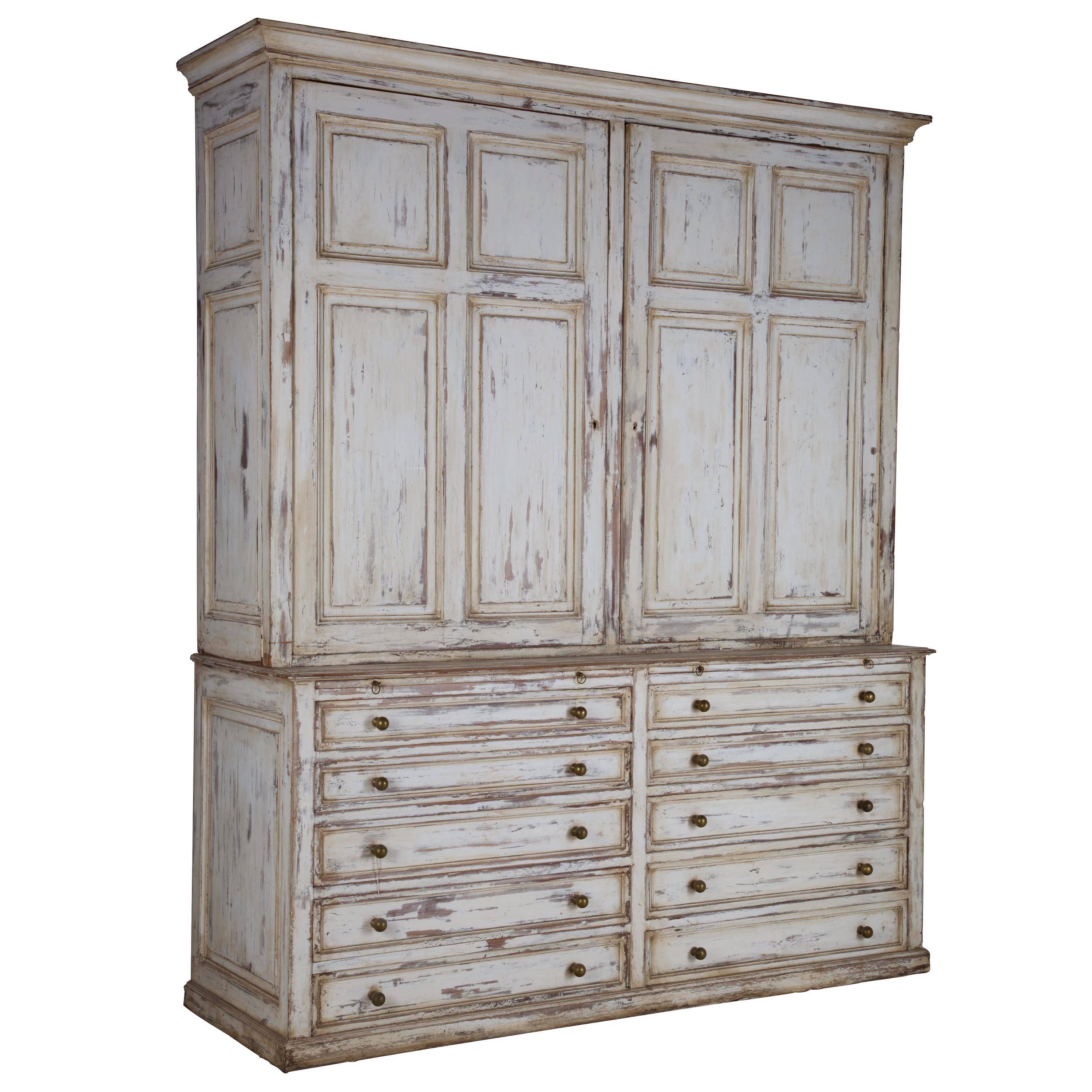 Late 19th century cupboard on chest in later paint.