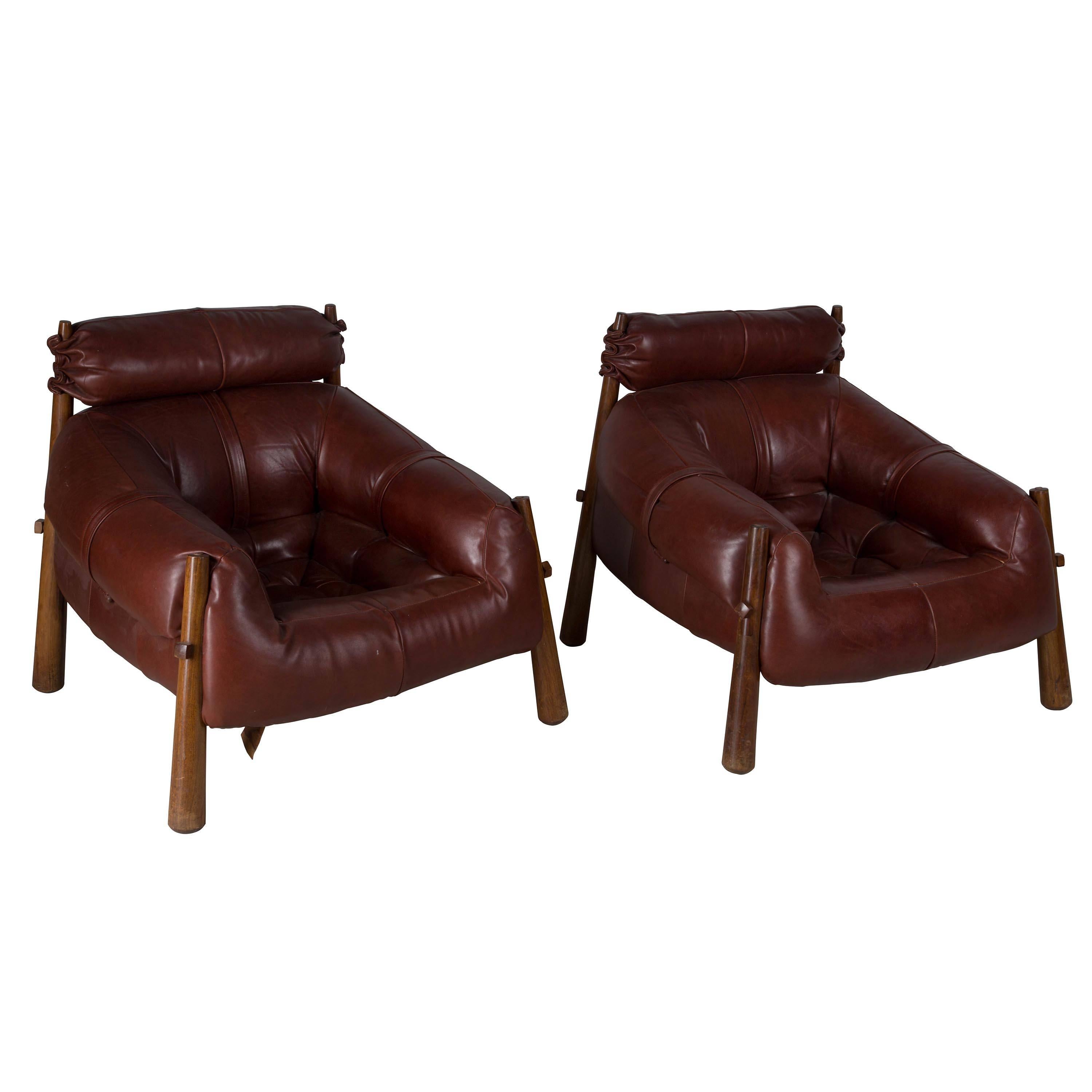 A pair of 1950s Brazilian leather armchairs.