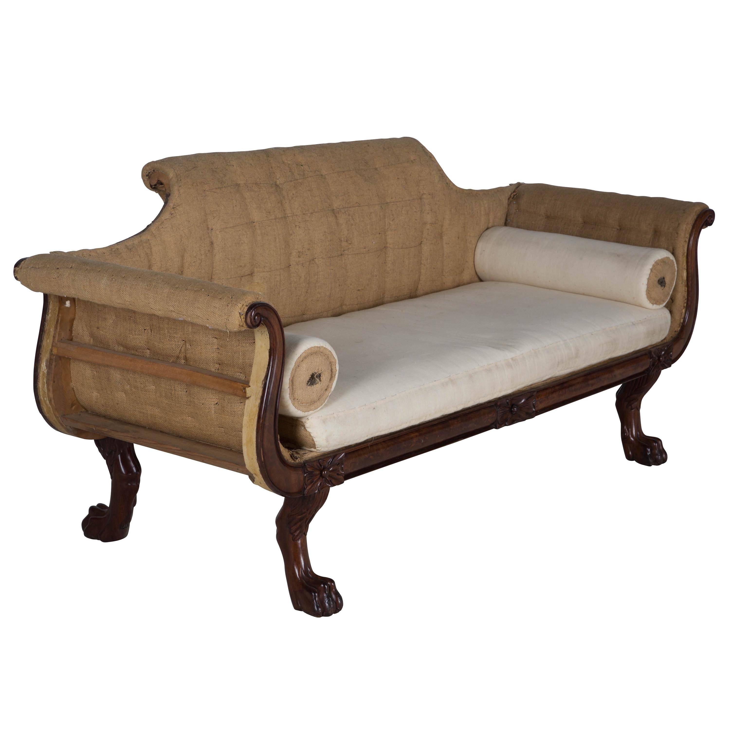 Regency mahogany sofa on four carved claw feet, circa 1820, Irish.