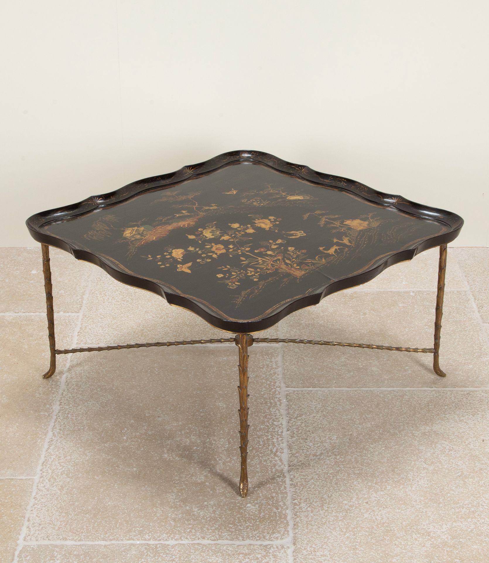 Rare 20th Century French Maison Bagues Chinoiserie lacquered low coffee table. 
Mounted on a gilt bronze palm leaf base.
Circa 1970.