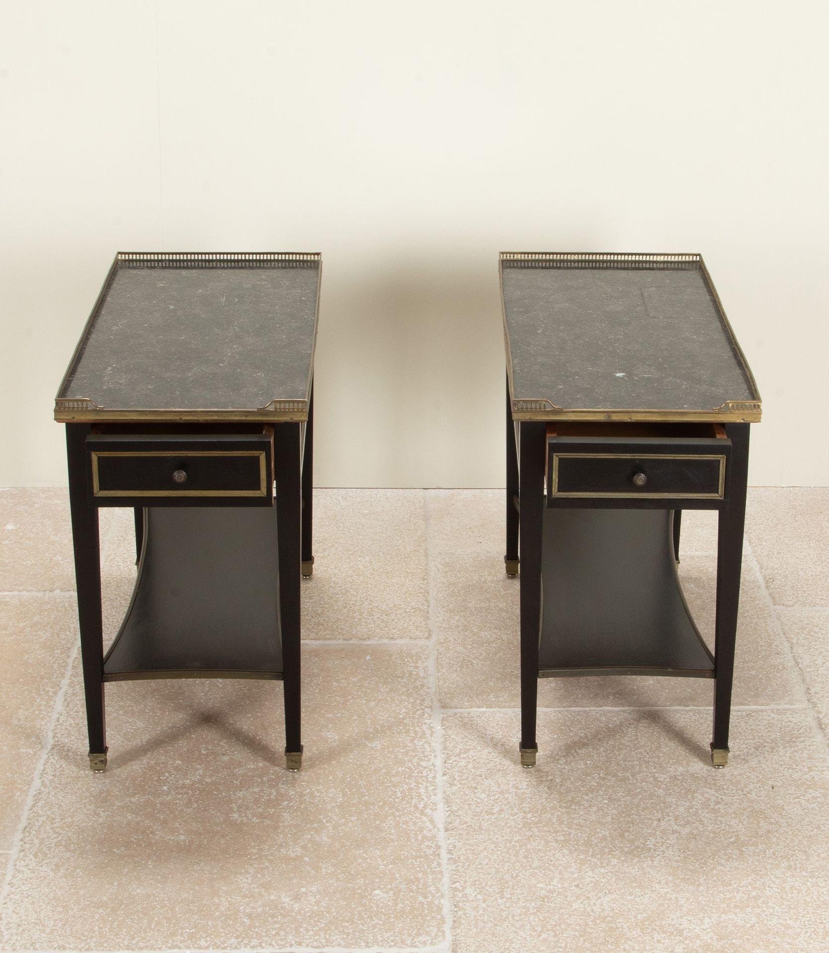 A substantial pair of 20th Century French ebonised side tables.

With a single drawer, fossil marble tops, brass galleries and mouldings.

Circa 1970.