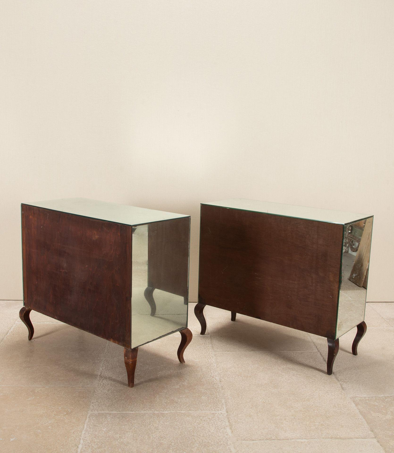 An extremely rare pair of 20th Century French Art Deco beech and mirrored commodes. 

One slightly deeper than the other. Some mild foxing to the mirror glass commensurate with age, no chips or damage.

Circa 1940.