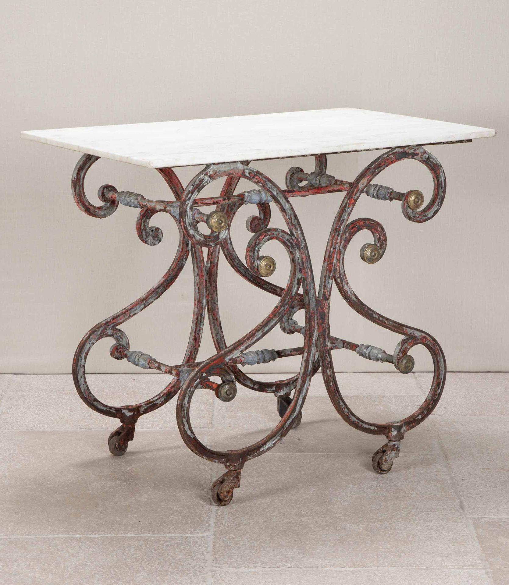 A wonderful late 19th Century butcher's table from the South of France. 
Beautifully constructed in the Papillon style (butterfly) with a cast iron base and its original marble top. Tables such as this one, were originally used in a butcher’s shop