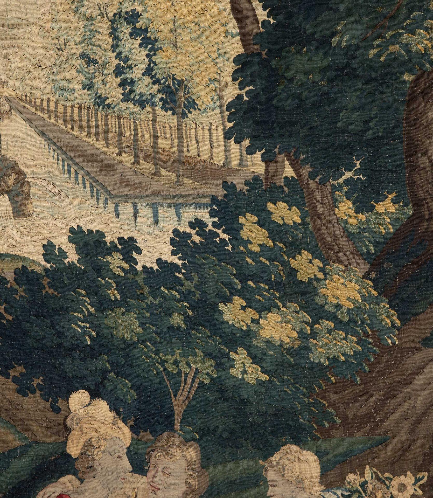 An early 18th Century Flemish tapestry woven in Lille by Guillaume Werniers. The flower vendor and his young assistants offer their flowers to the local nobility, the background of a tree lined street is typical of Lille weaving, the boarder has