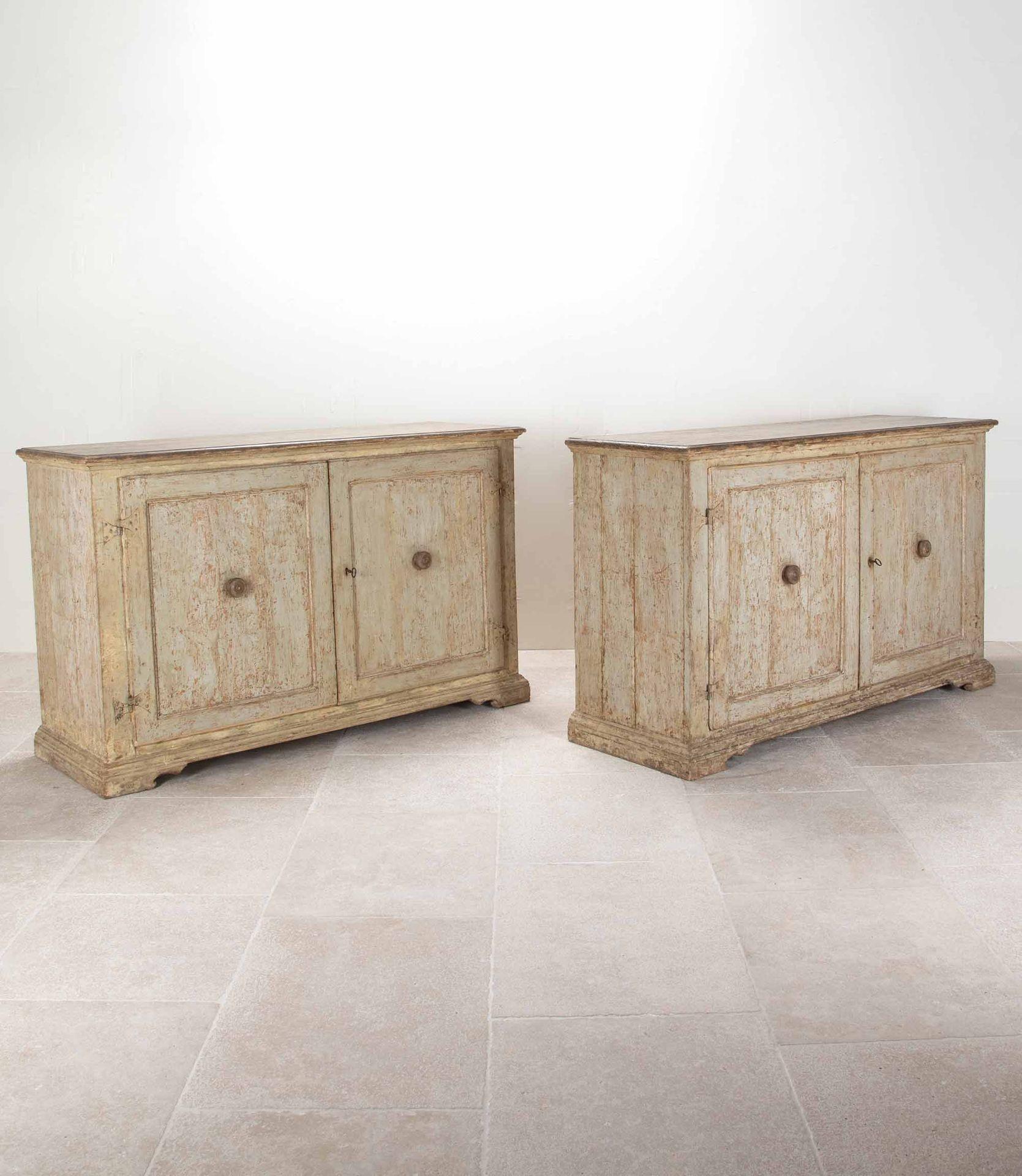 An unusually large and well preserved pair of 18th Century Italian buffets.
Retaining their original delicate paintwork and ironmongery. Each containing a shelf to the spacious interior.