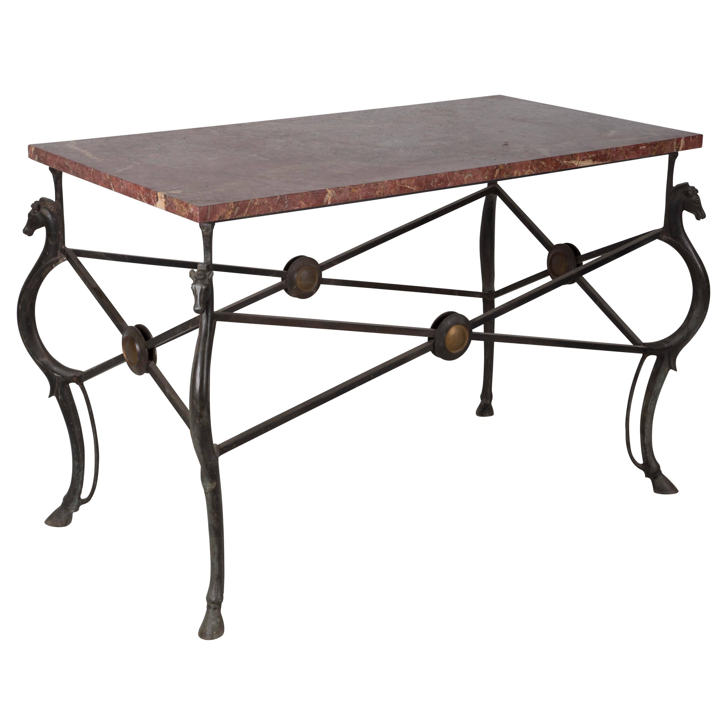 Horse head bronze table with Rosso Imperio marble top. Attributed to Gilbert Poillerat, circa 1935.