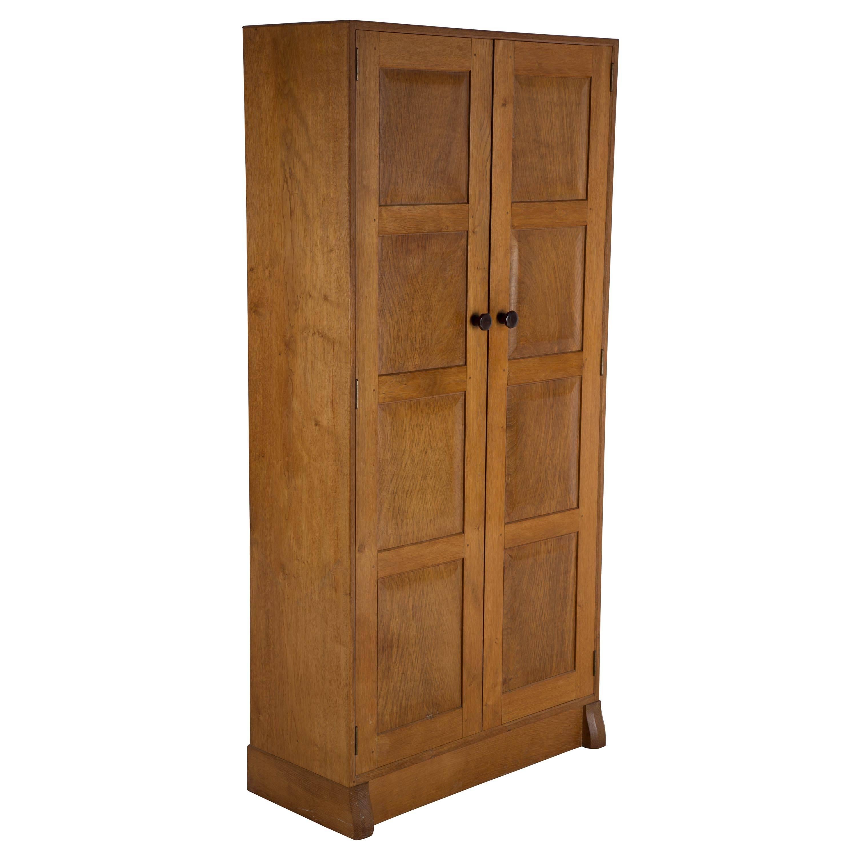 Arts & Crafts Cotswold School oak, cedar and Macassar hall wardrobe, circa 1950. Well constructed with fielded panels, pegged joints and Macassar hardware.