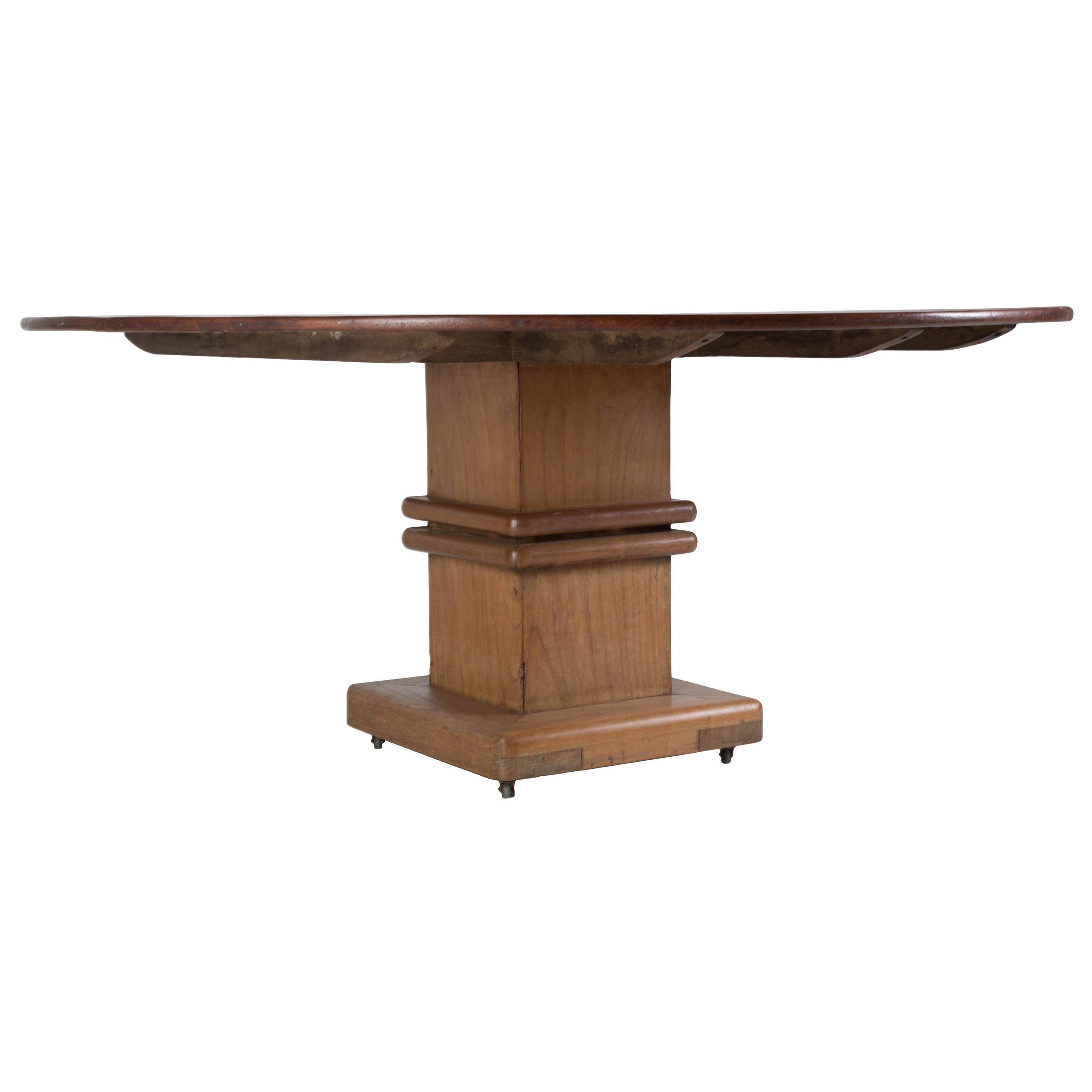 An Art Deco period Anglo Indian circular teak table on square column base.