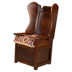 George III Joined Oak and Elm Wing-Back Lambing Chair